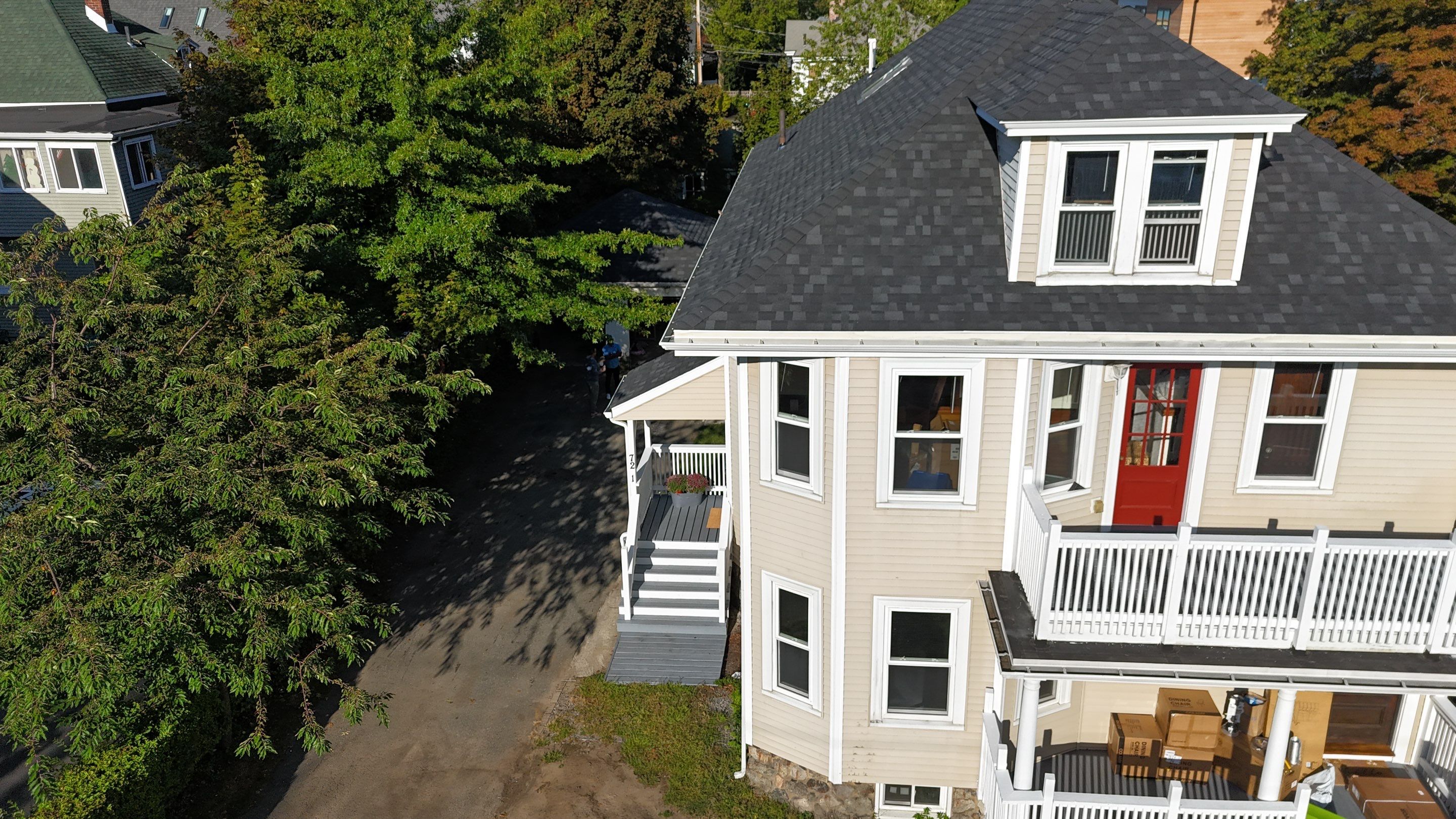 Roof Replacement with Skylight Flashing in Waltham, MA by Mighty Dog Roofing of Greater Middlesex County