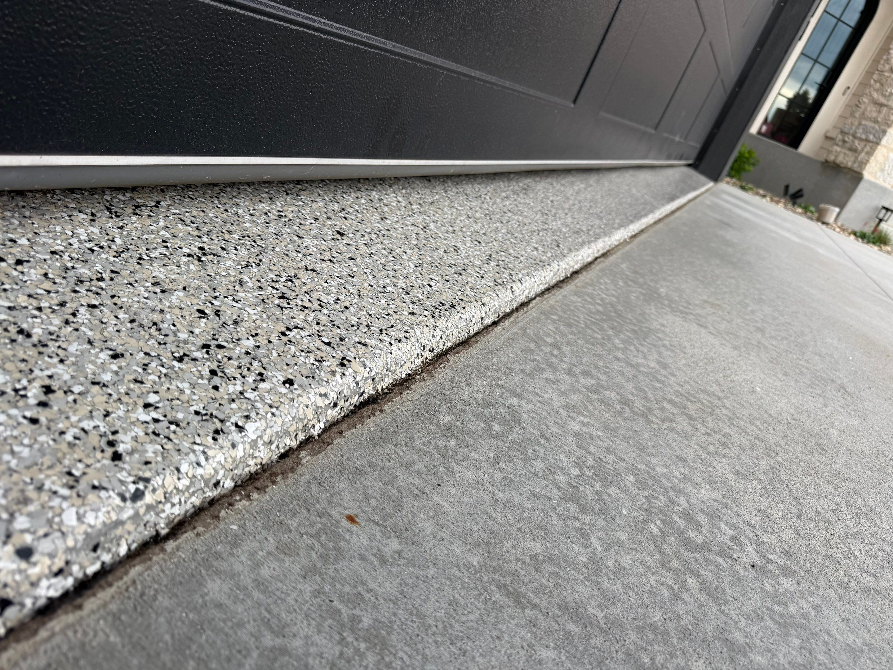 Custom Speckled Concrete Coating for Dell Rapids Garage by Select Painting, Coatings & Garage Cabinets