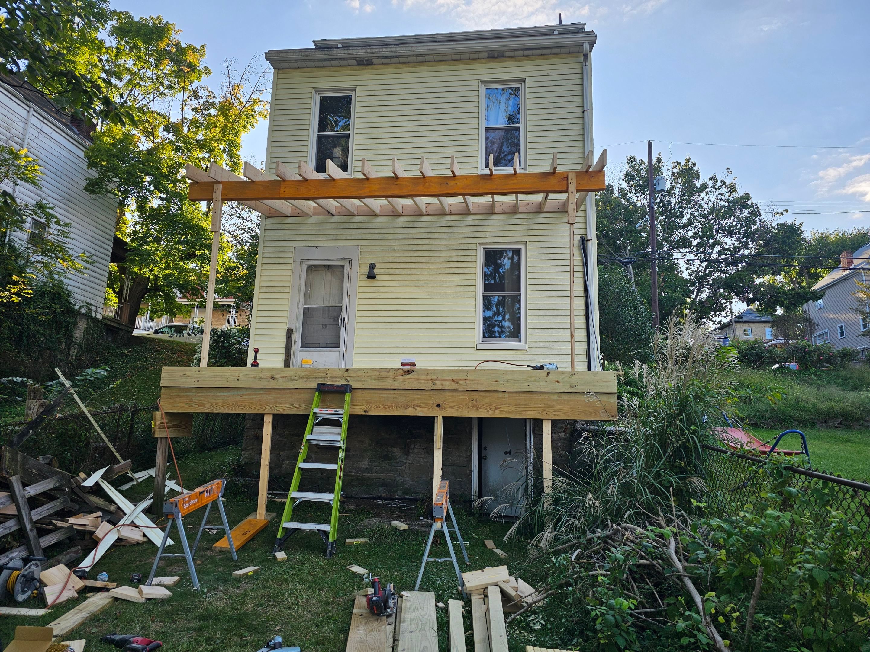 Deck and shed roof by Cousins Roofing Siding & Decks