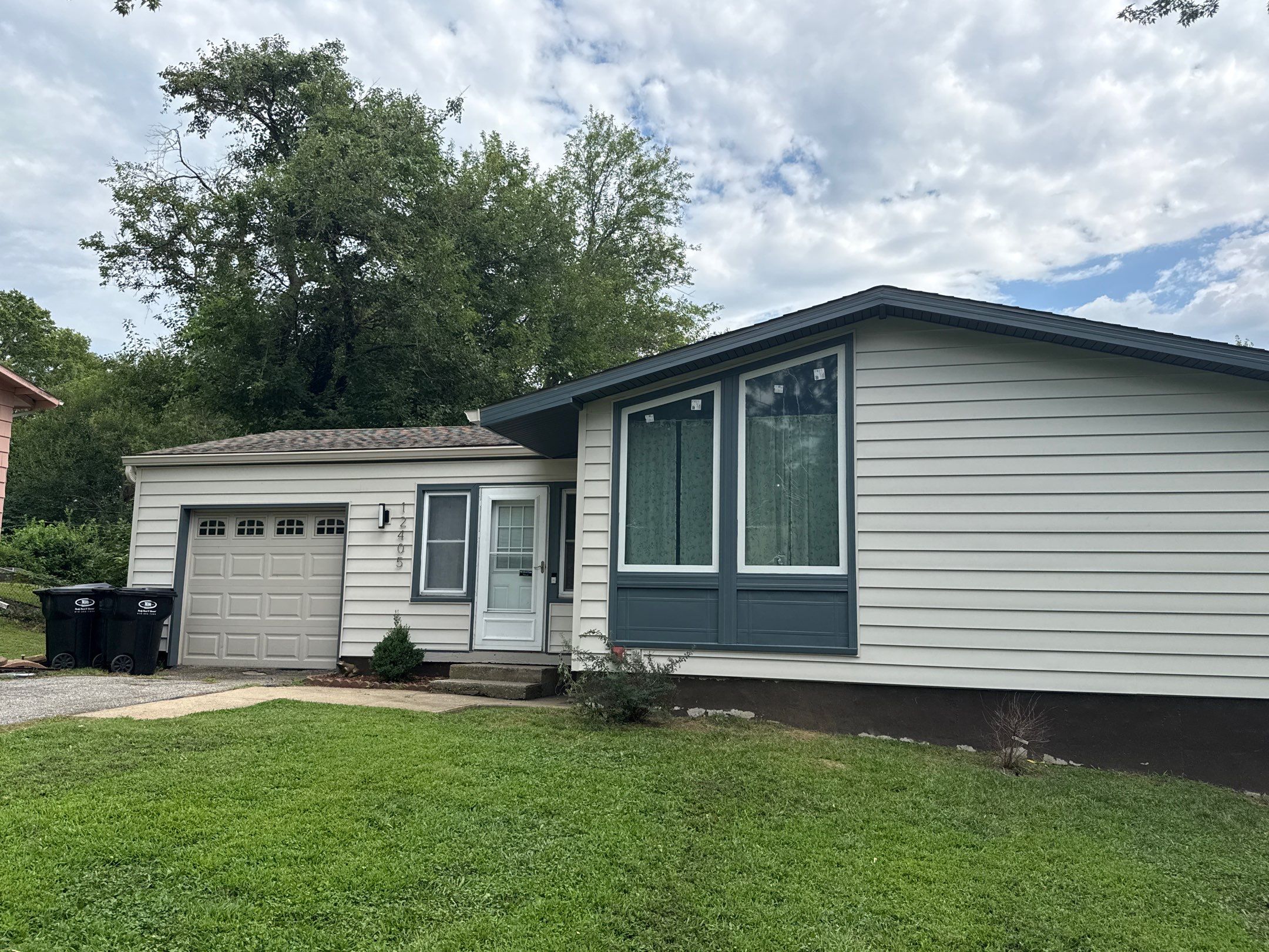 Complete Exterior Transformation With Craneboard Siding and Heartland Windows by EEC Windows, Siding & Roofing