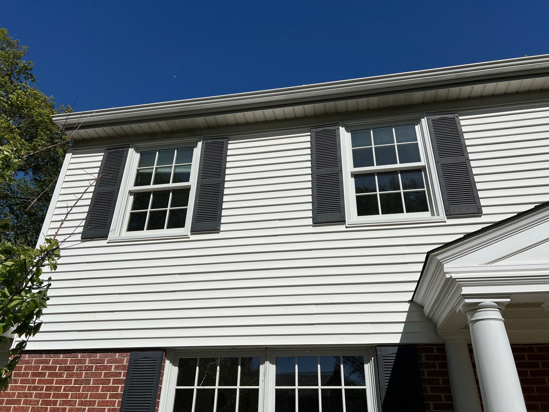 Housewashing  using Algaecide, soft wash soap by Northern Power Washing LLC.