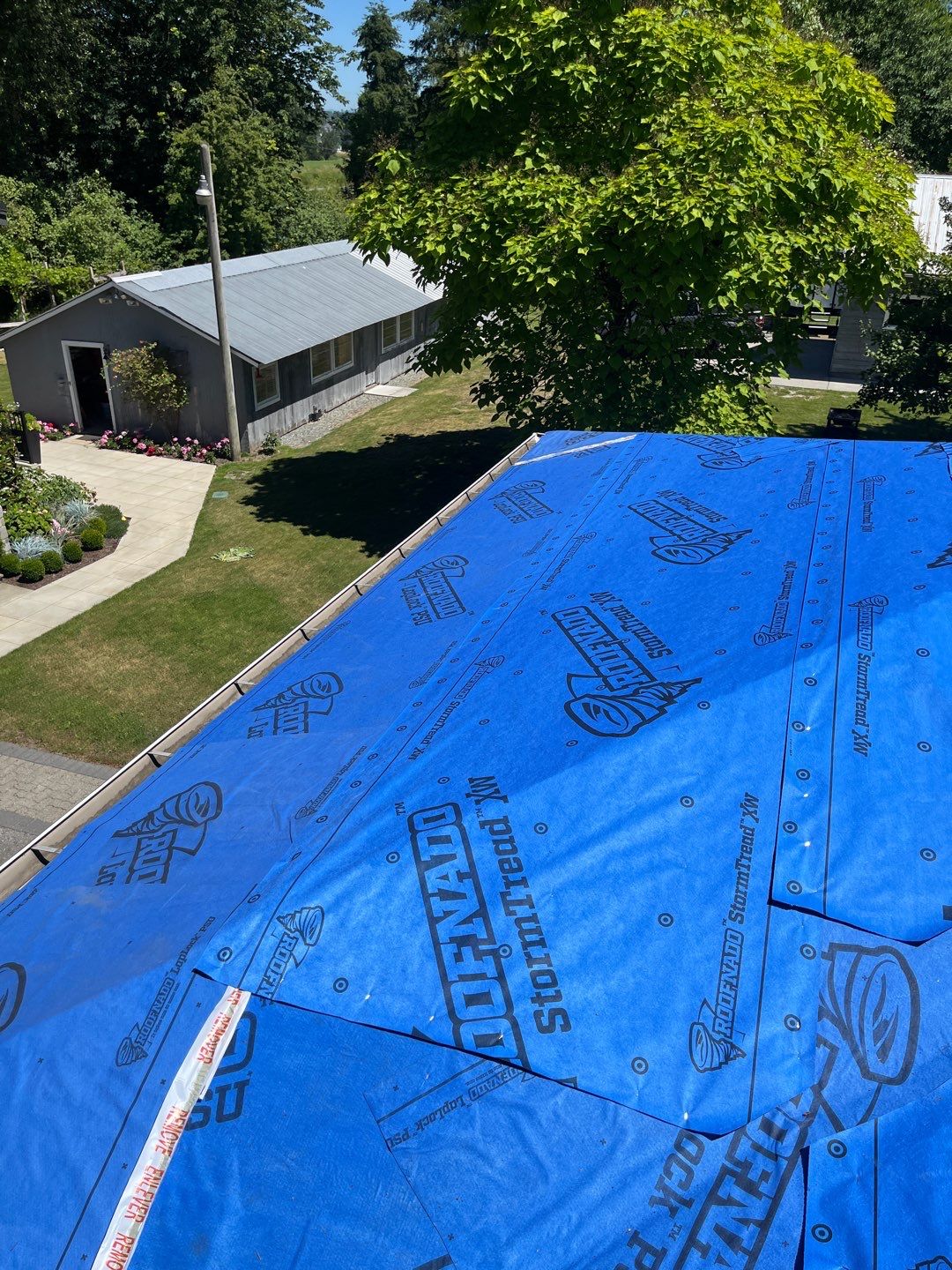 Residential Roofing Installation using 12" Prolok metal  by Top Notch Roofing Inc