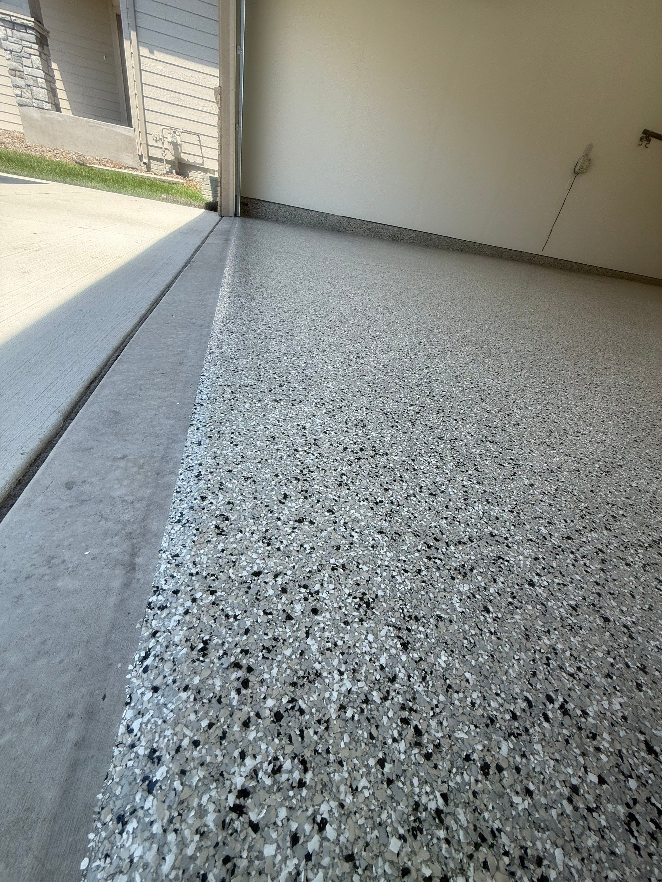 Cabin Fever Garage Floor Coating in Sioux Falls by Select Painting, Coatings & Garage Cabinets