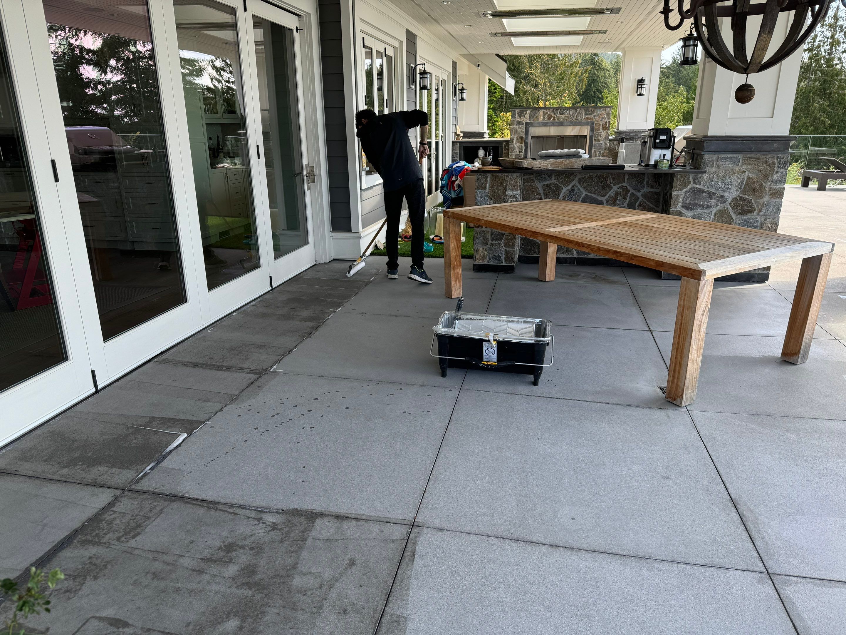 Applying Concrete Sealer  by YVR Construction Group