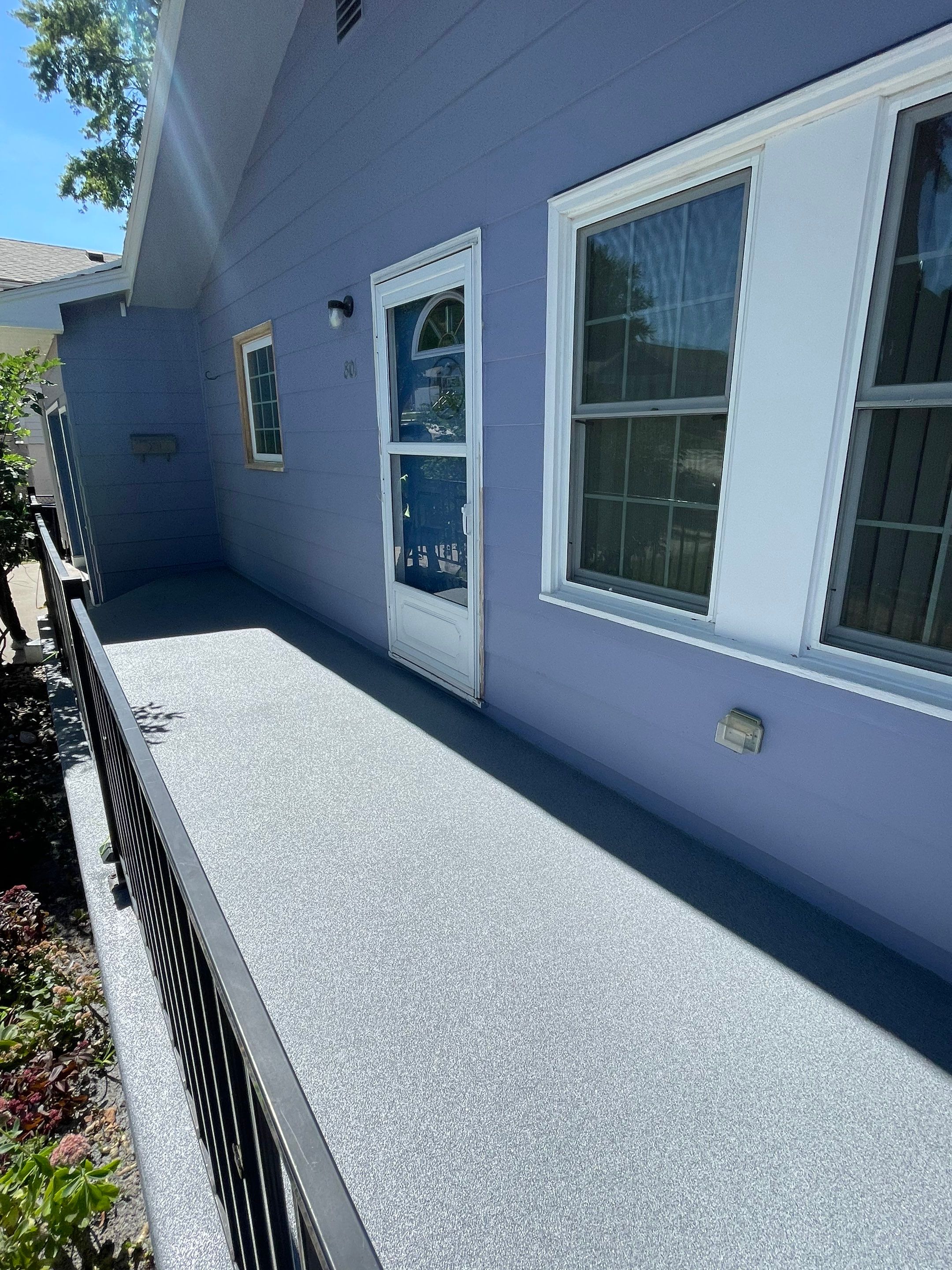 Sioux Falls Concrete Porch Coating with Starry Evening Finish by Select Painting, Coatings & Garage Cabinets