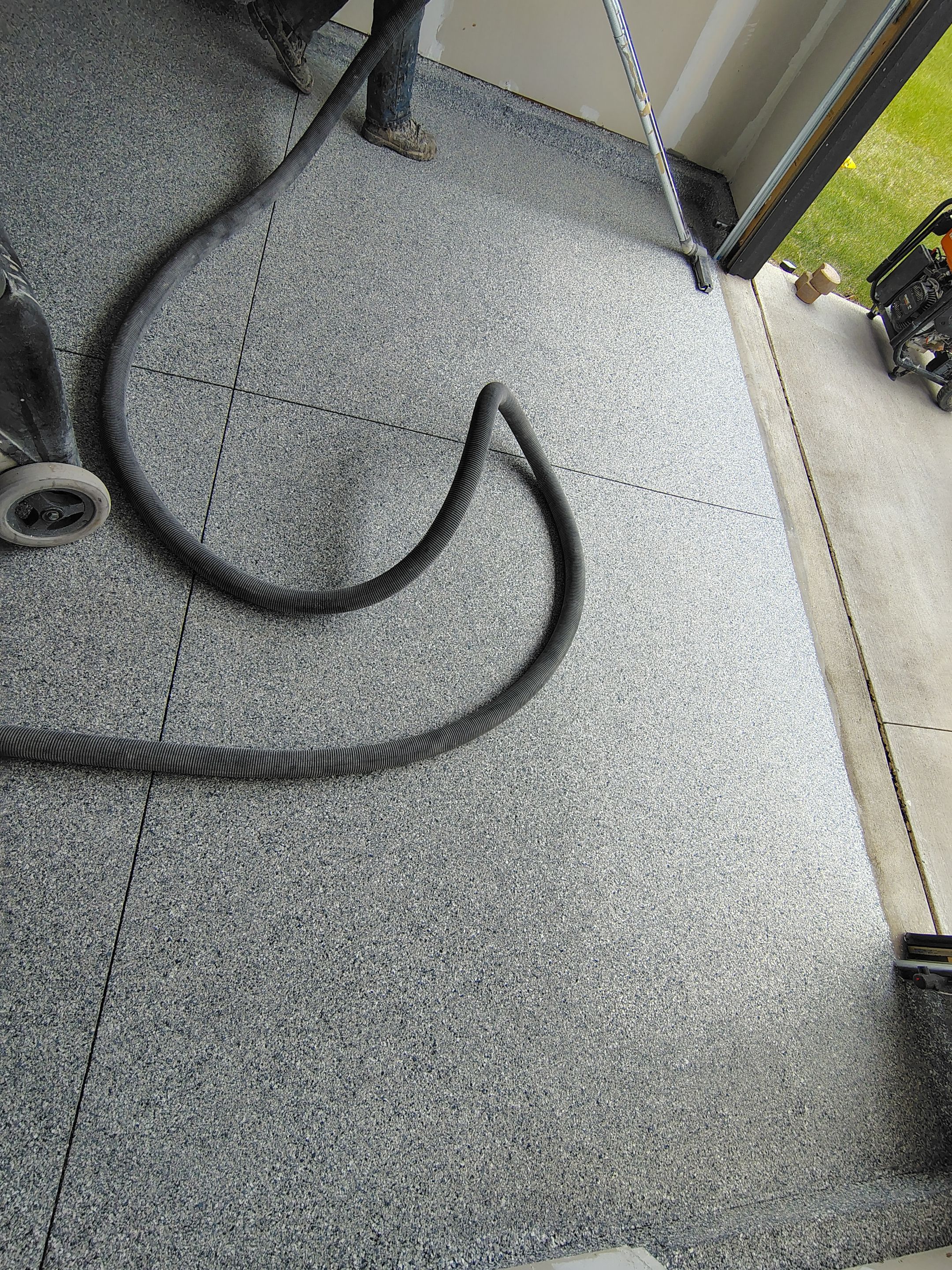Custom Epoxy Garage Floor Coating Installation in Sioux Falls by Select Painting, Coatings & Garage Cabinets