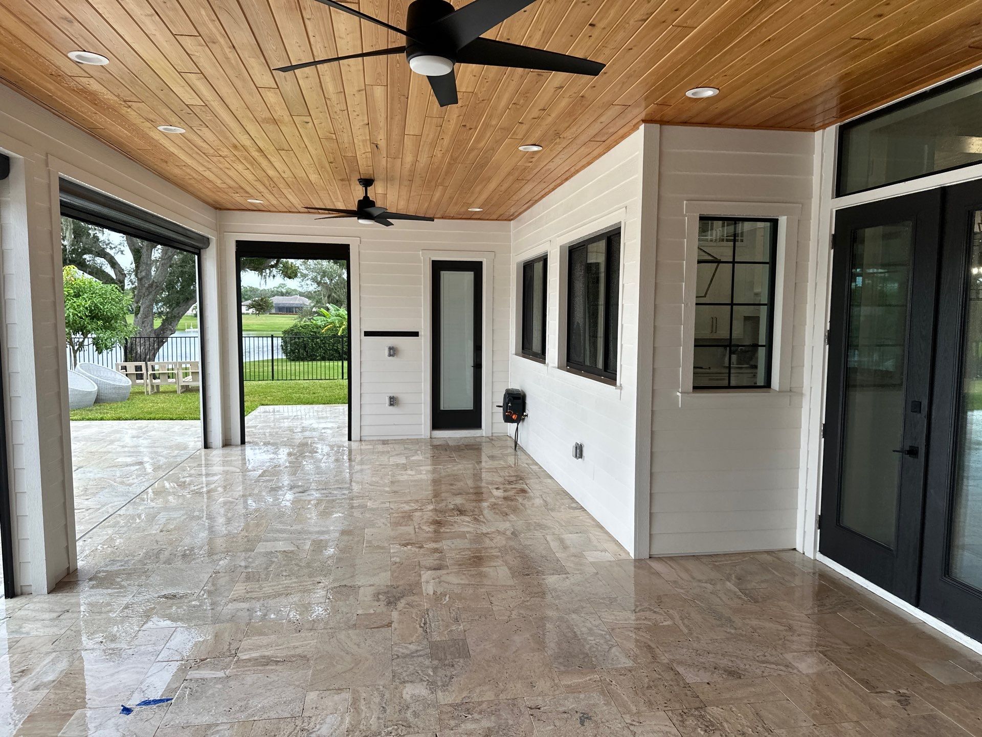 Complete Two-Story House Wash and Driveway Cleaning in Winding River Community, Bradenton, FL by Sunshine AquaWash