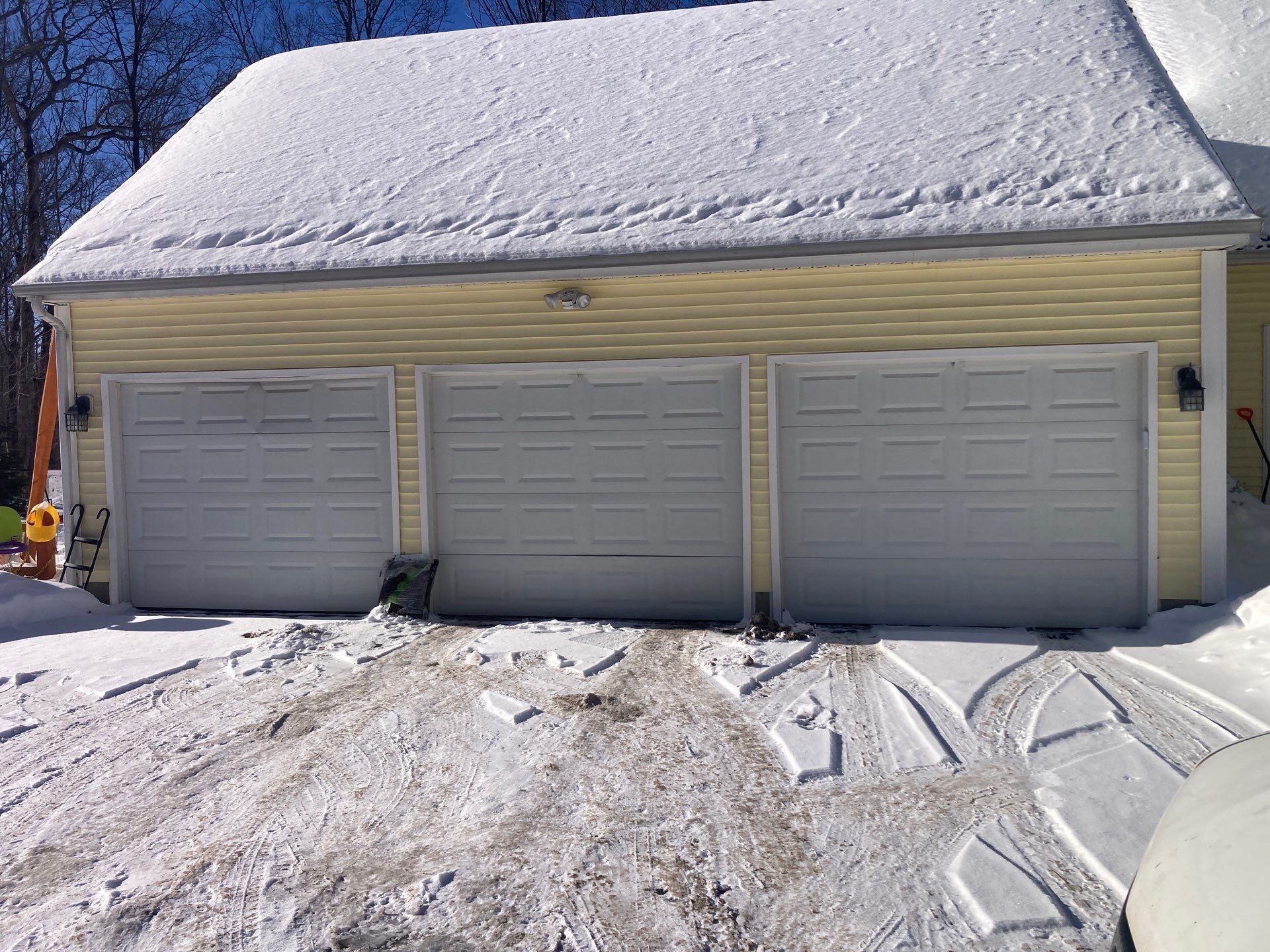 Modern Triple Garage Door Upgrade by DiGiorgi Roofing and Siding Inc