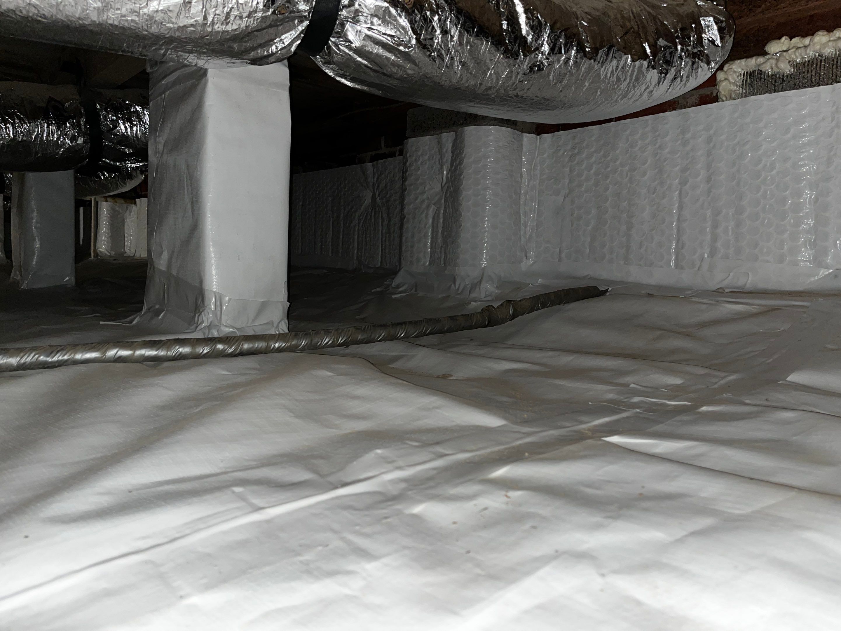 Impact Choice Encapsulation with new piers and crawlspace door. by Impact Crawlspace