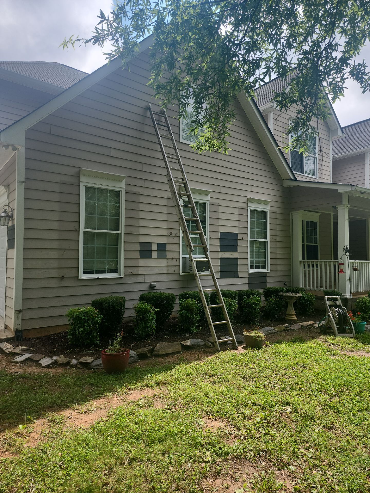 Siding replacement, exterior painting, and front door staining. by GonzalezPainters & Contractors Inc