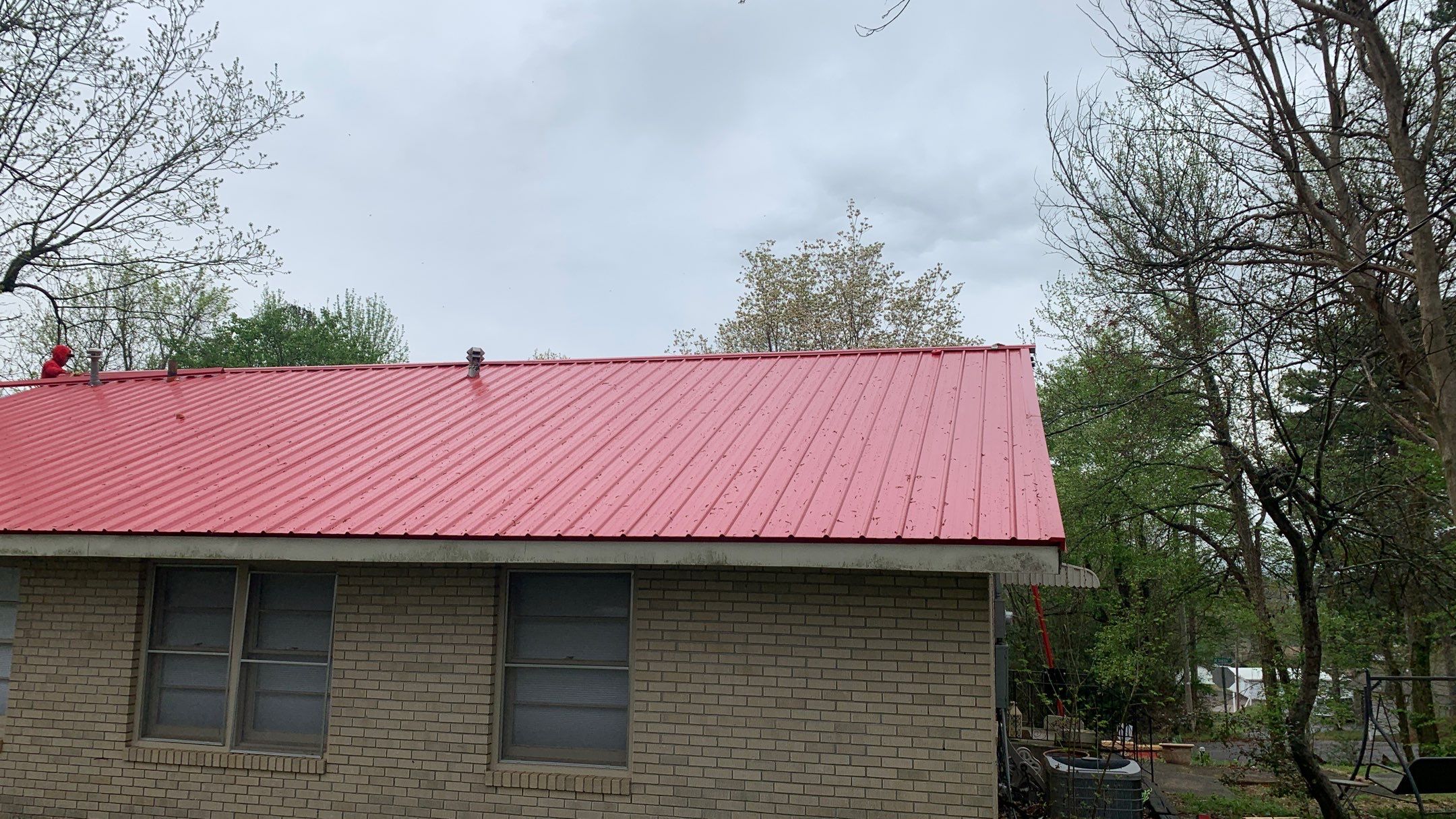 Residential Roofing Installation using 26 Gauge Colored Panels by Hostetler Roofing