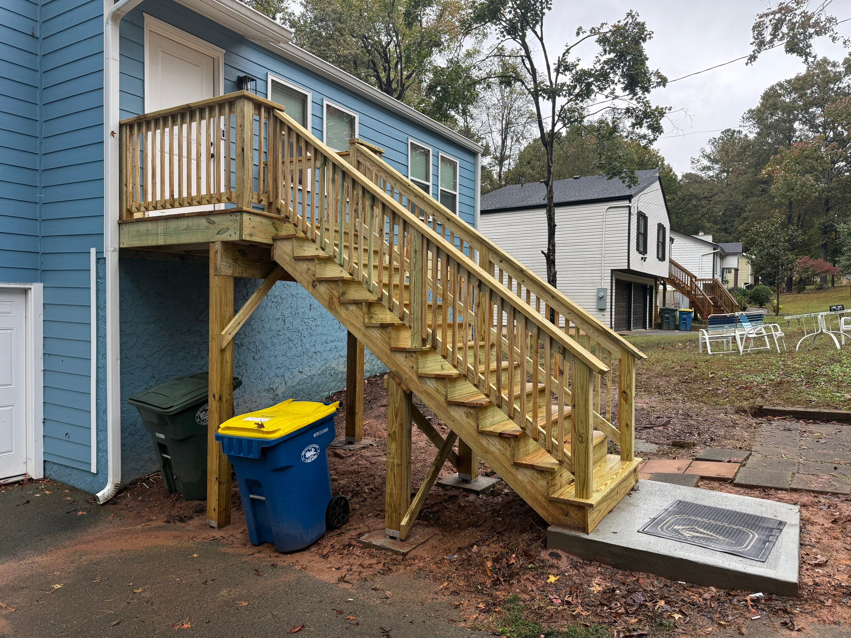 Custom Pressure-Treated Wood Staircase and Landing Installation by Swift Home Renovations