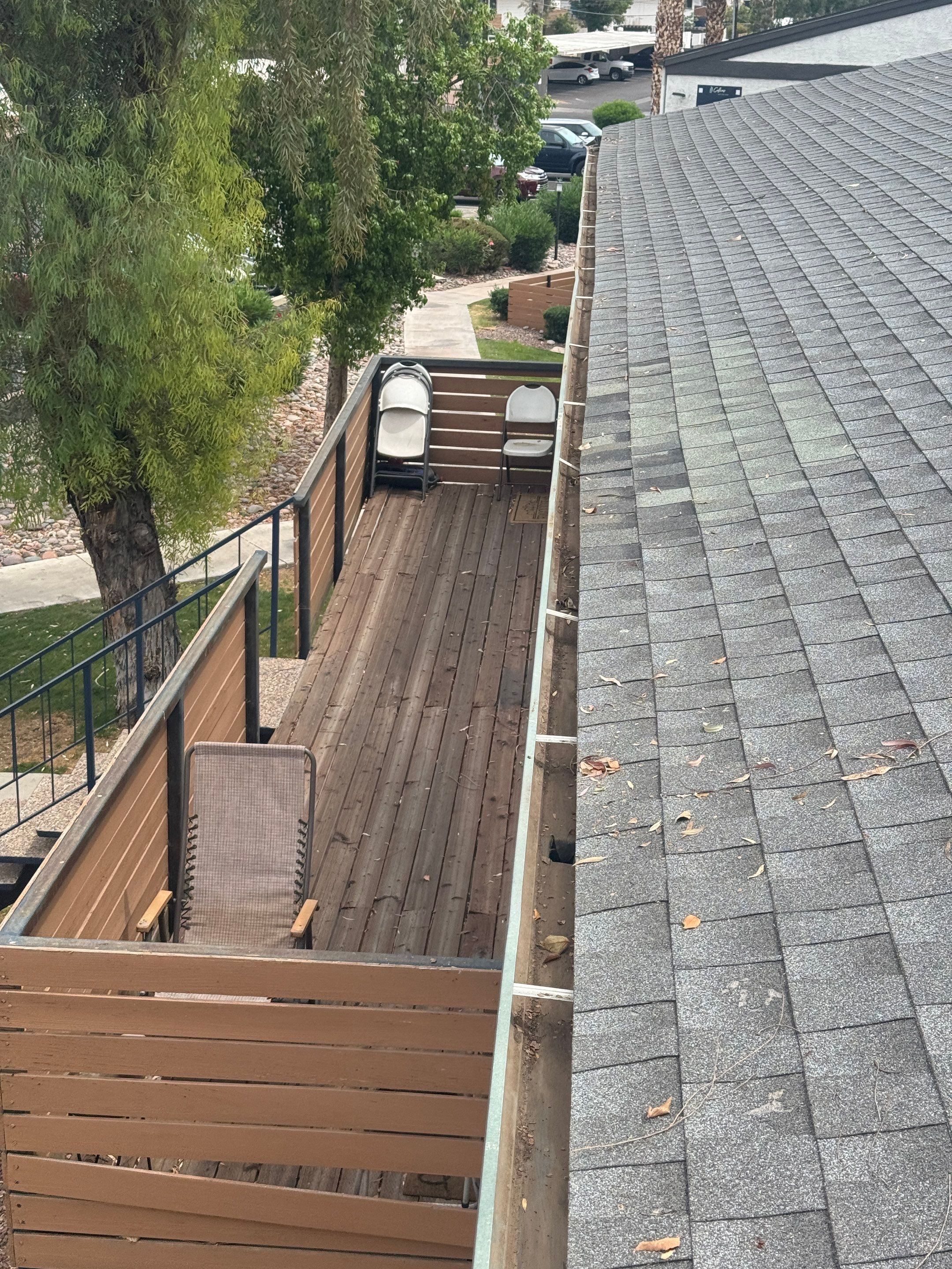 HOA gutter cleaning in Sun City & Surprise, AZ after  photo showing full gutters.