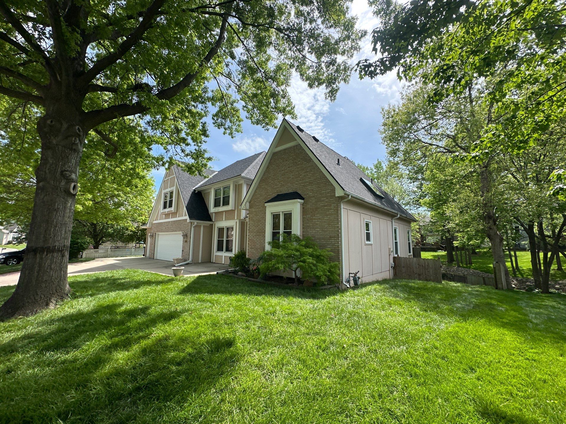 Comprehensive Roof Replacement and Skylight Installation in Kansas City by Liberty Roofing