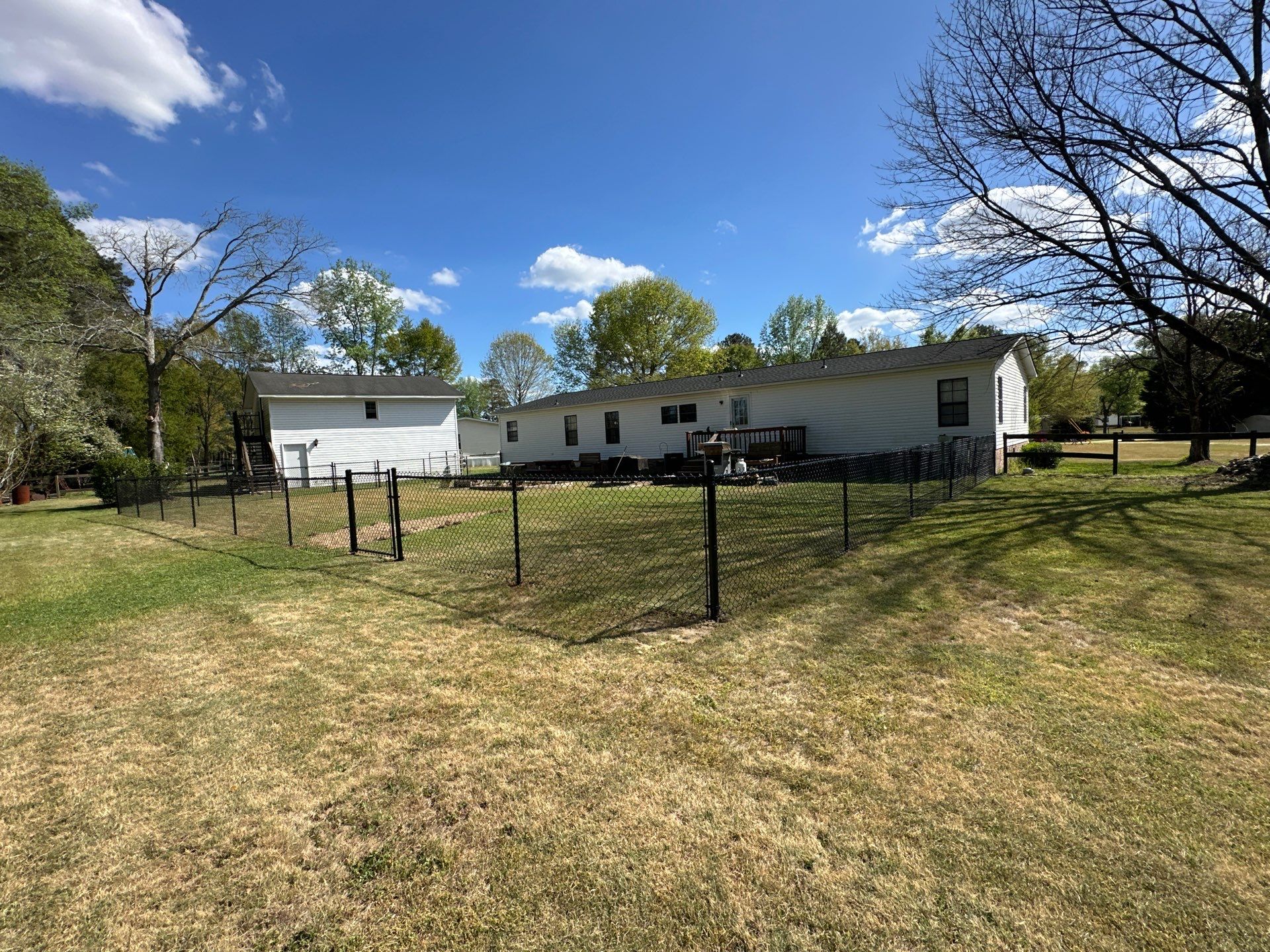 4'H Black Chain Link Fence in Lumberton NC by Superior Fence and Rail