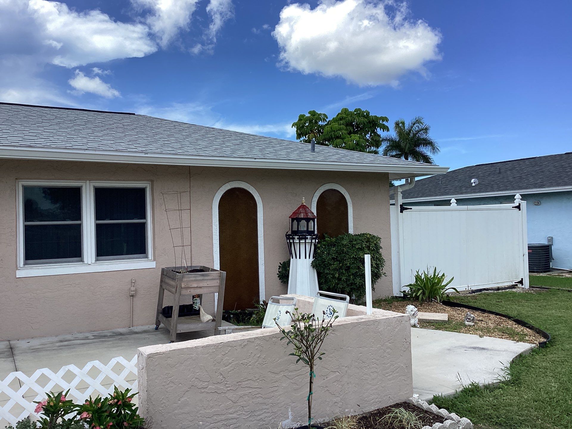 White Seamless Gutters and Splash Guards in Fort Myers FL by Gutter Professor by Gutter Professors