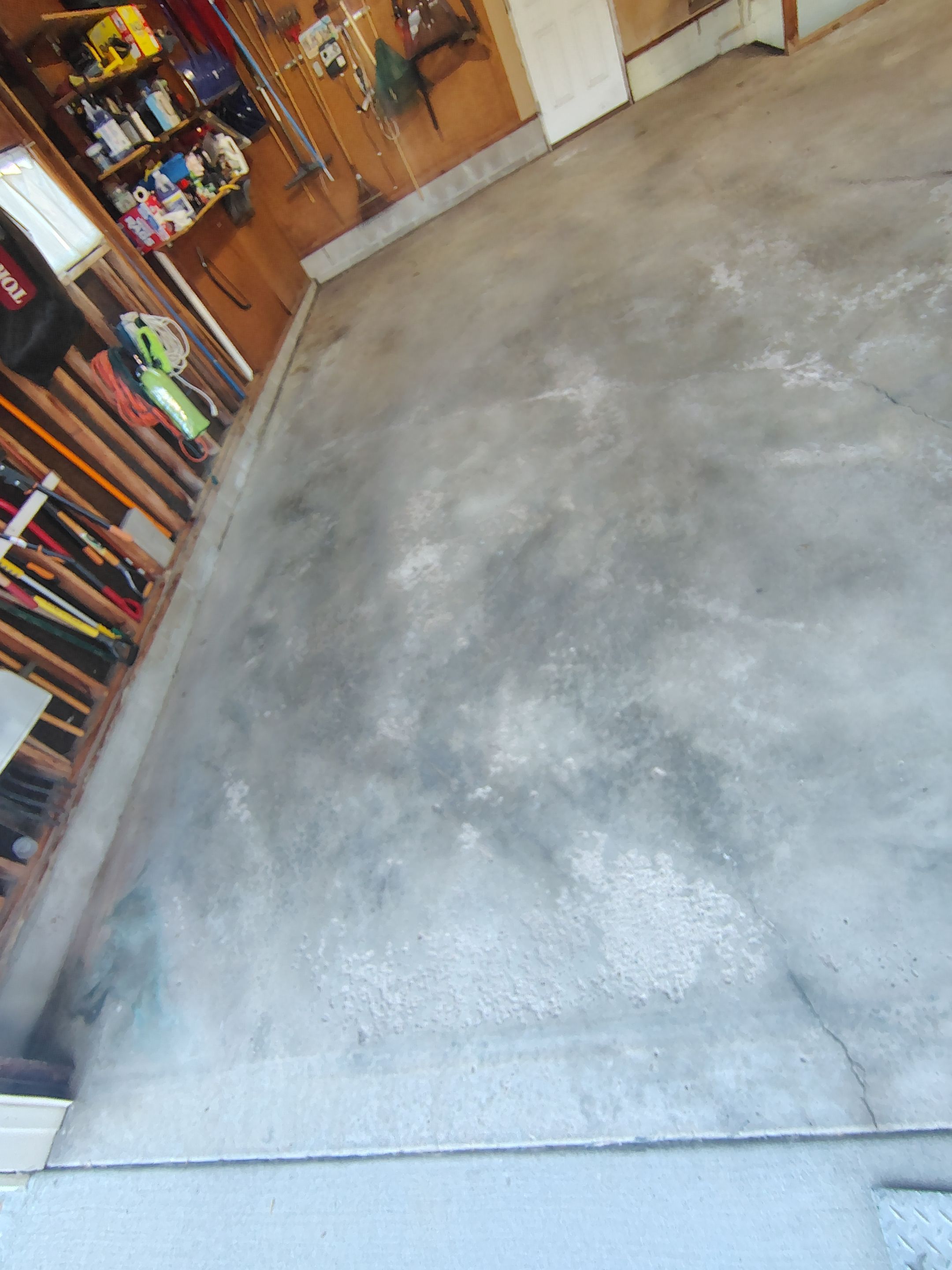 Sioux Falls Garage Epoxy Floor Installation and Concrete Crack Repair by Select Painting, Coatings & Garage Cabinets
