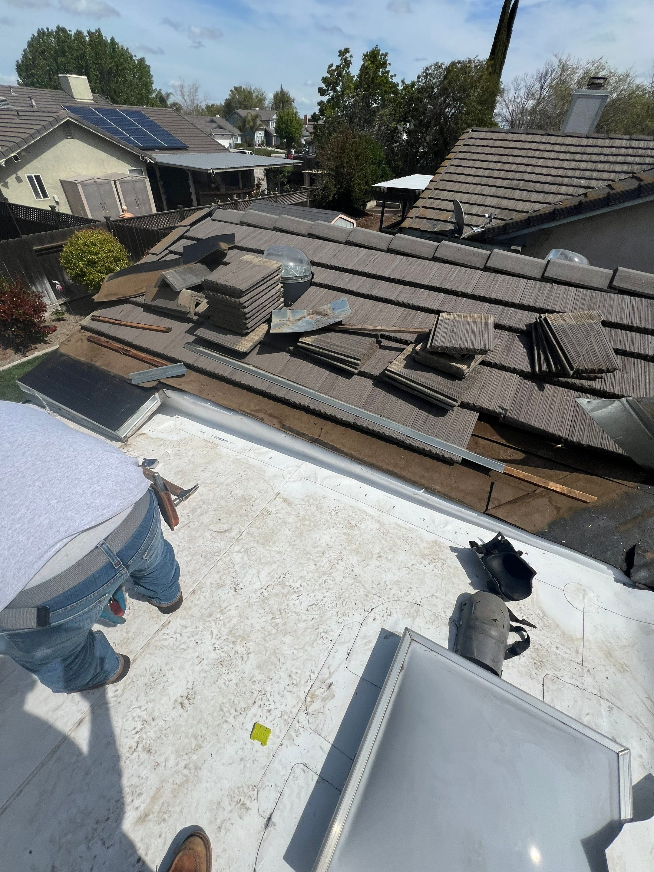 Single-ply roofing system on porch using TPO 60 mil by Straight Edge Roofing Inc