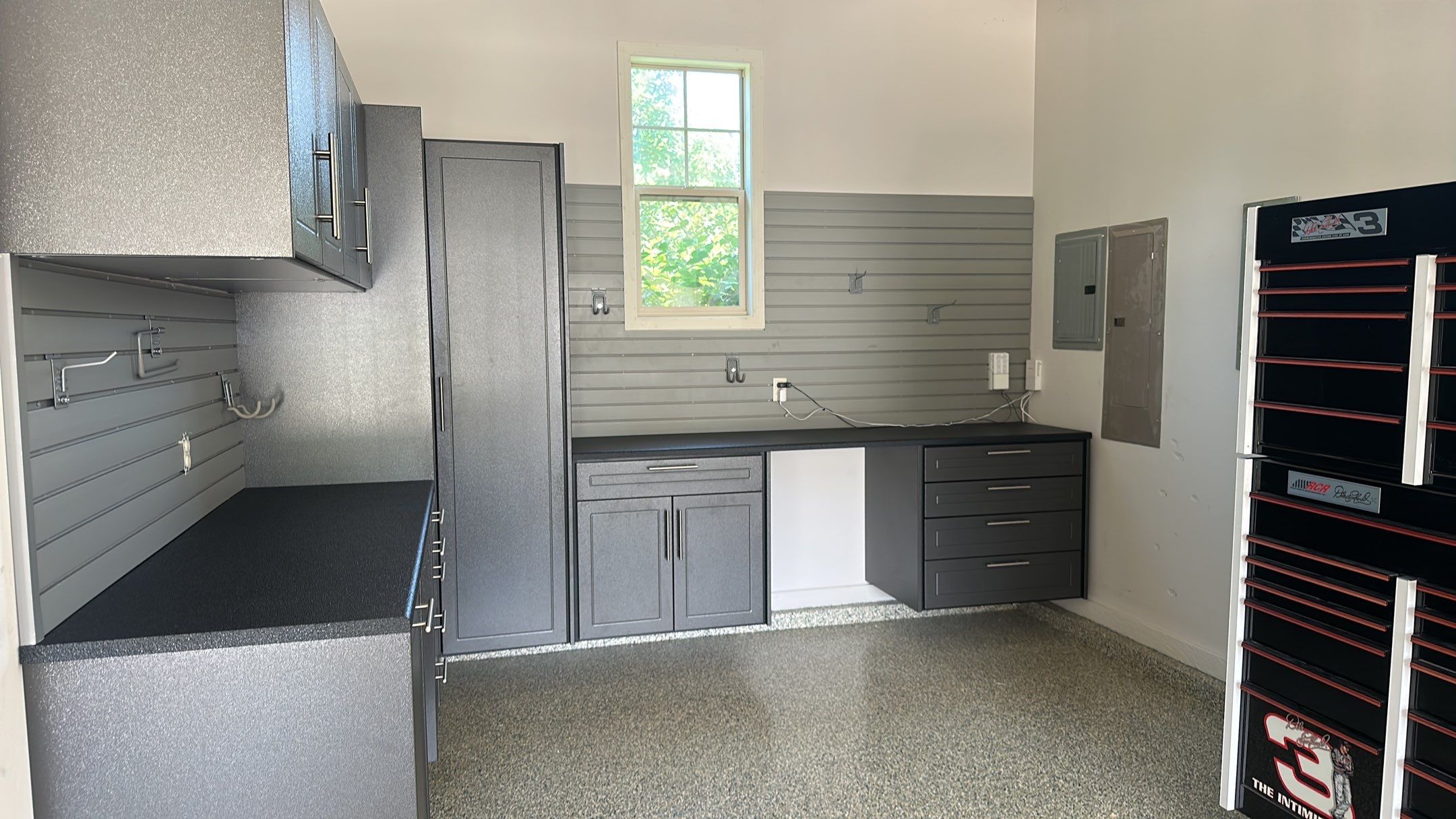 Lori H. upgrade her garage with cabinets and overhead racks by Banner Garage