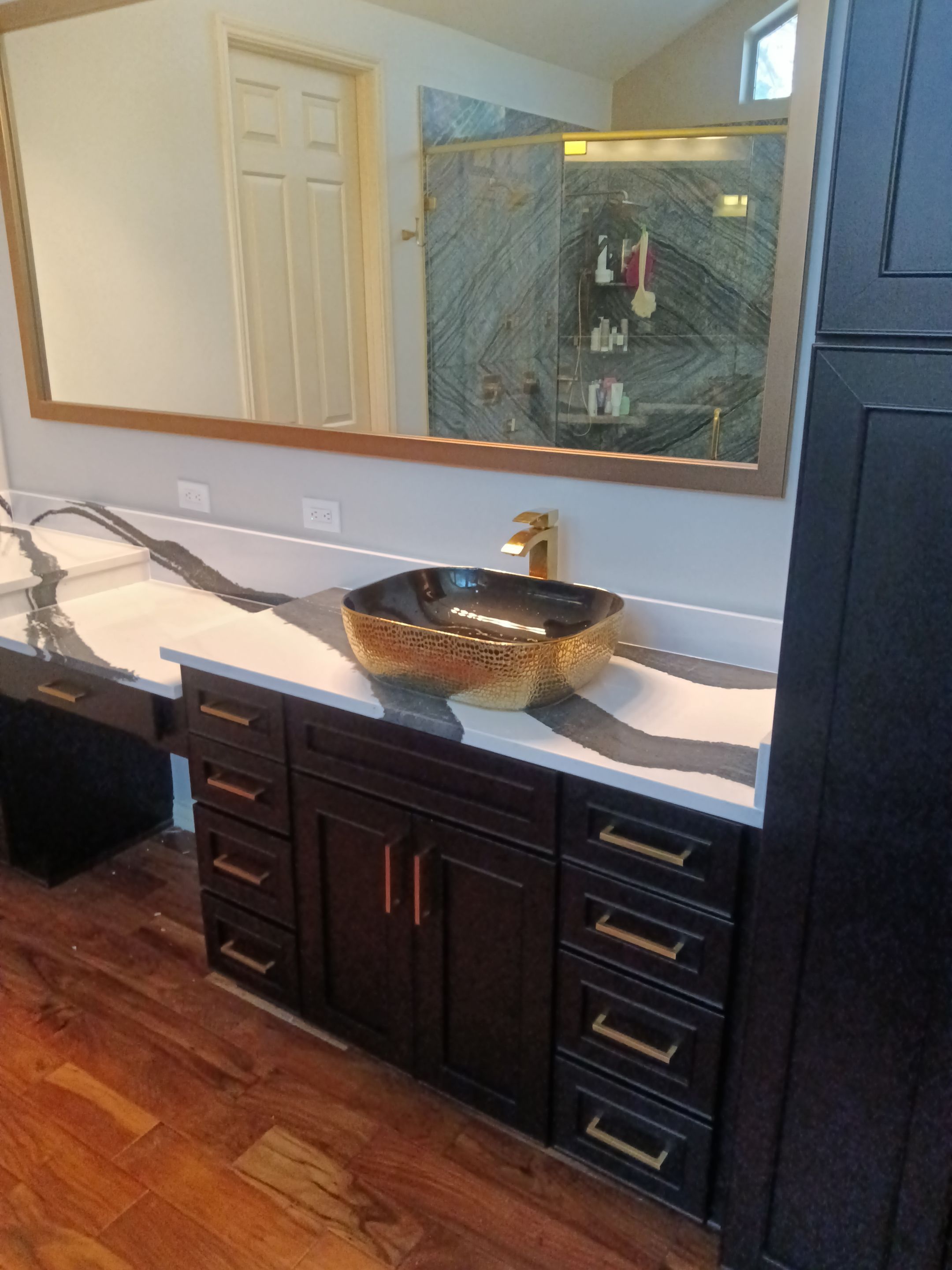 Bookmatched Natural Stone Shower by Legacy Bath and Kitchen 