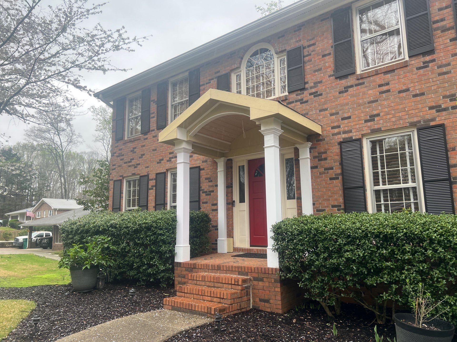 Exterior Entryway and Trim Renovation for Smyrna Brick Colonial by Swift Home Renovations