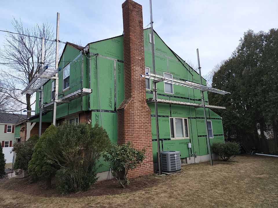 James Hardie siding, new metal roof and couple windows being installed. by UBrothers Construction