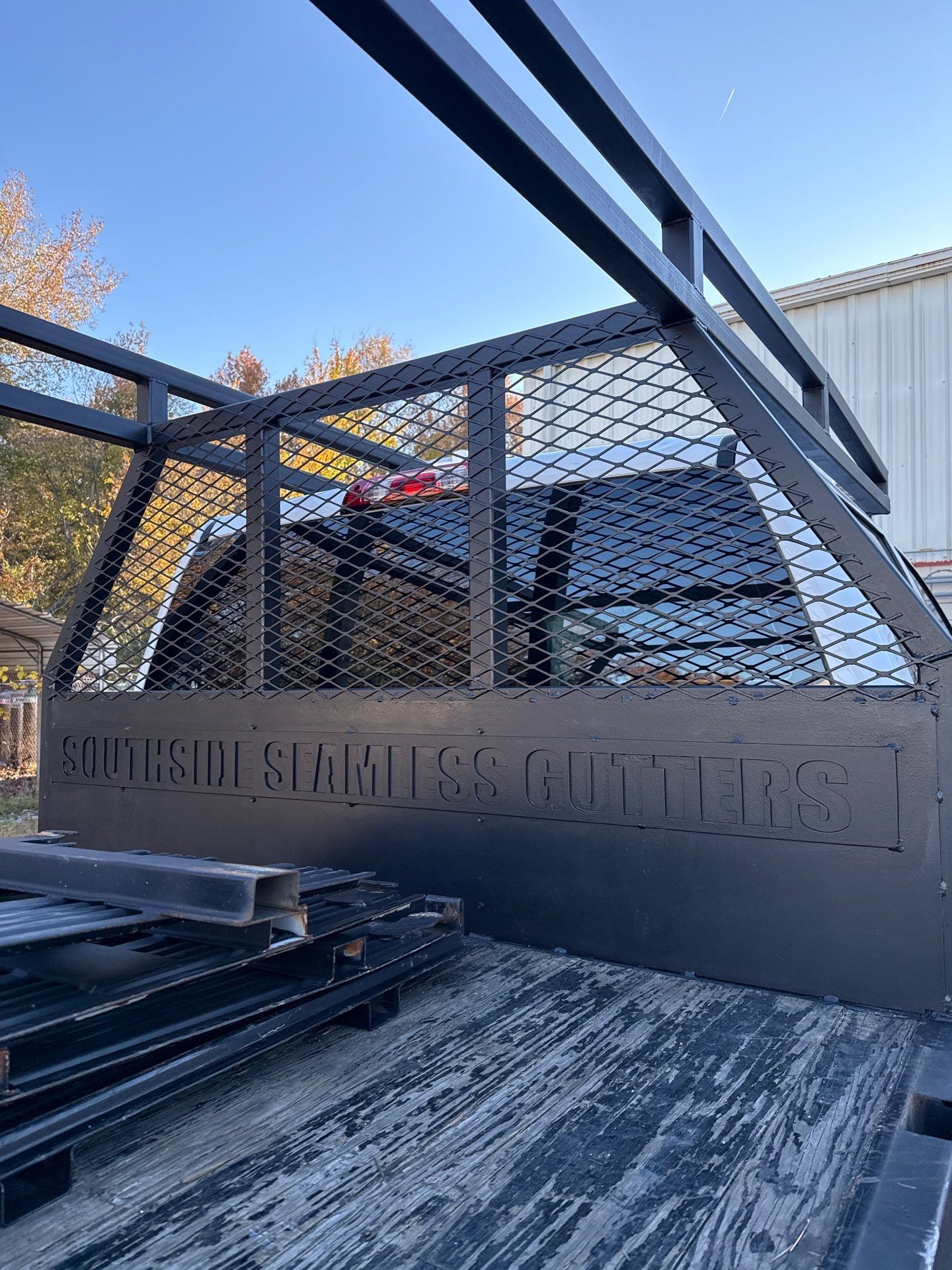 Seamless Gutters Ladder Rack by Gregory Sandstrom