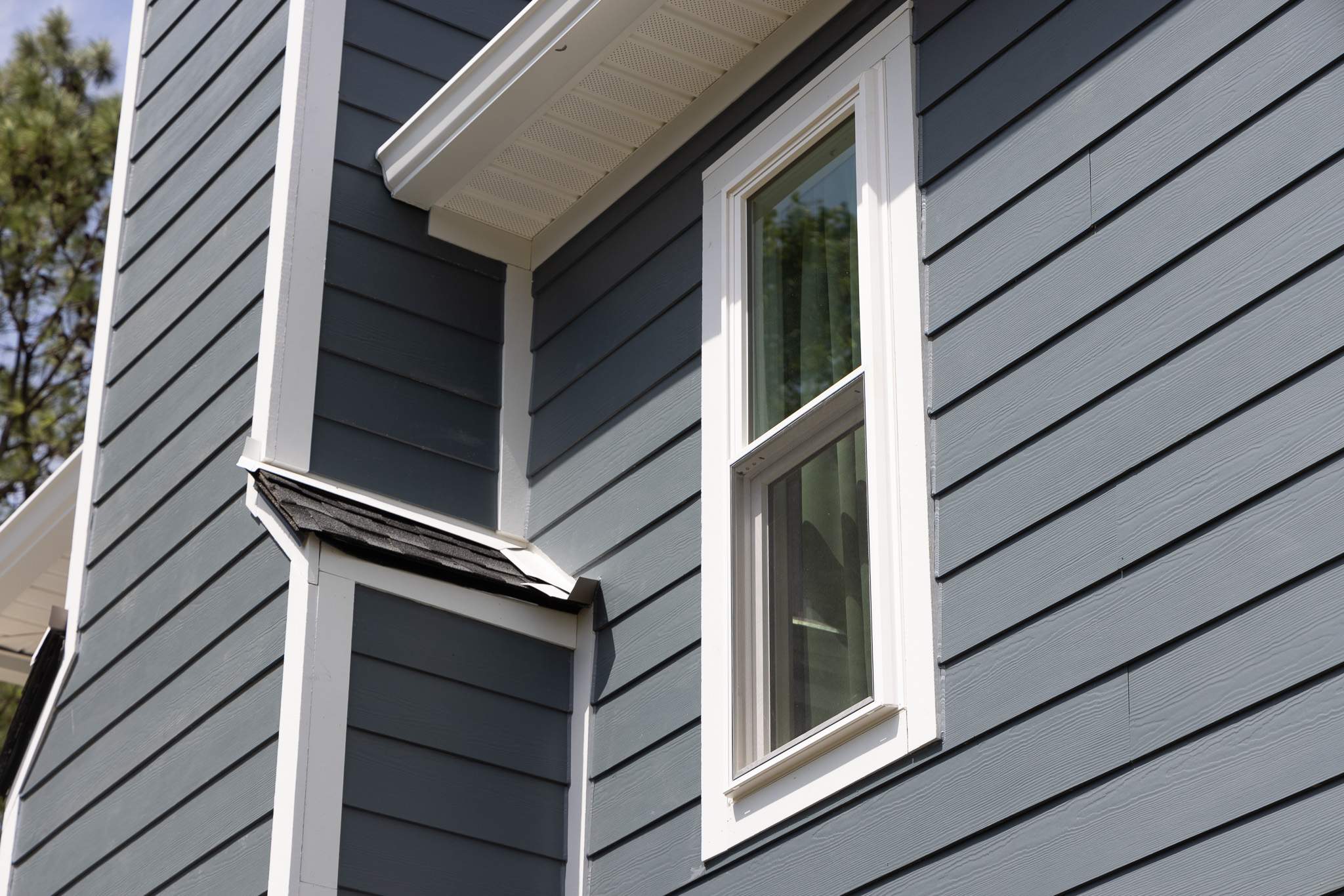 Evening Blue Hardie + Windows by Freedom Exteriors