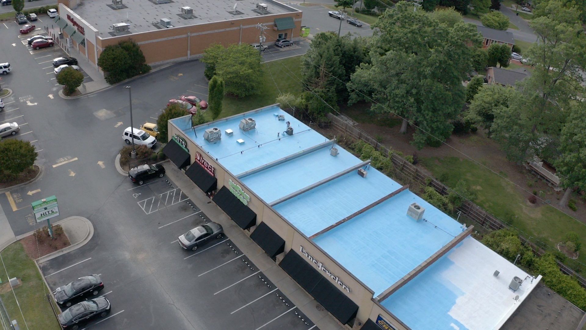 Commercial Roof Coating using Fiberseal basecoat and Silicon Topcoat by Just In Time Roofing and Restoration