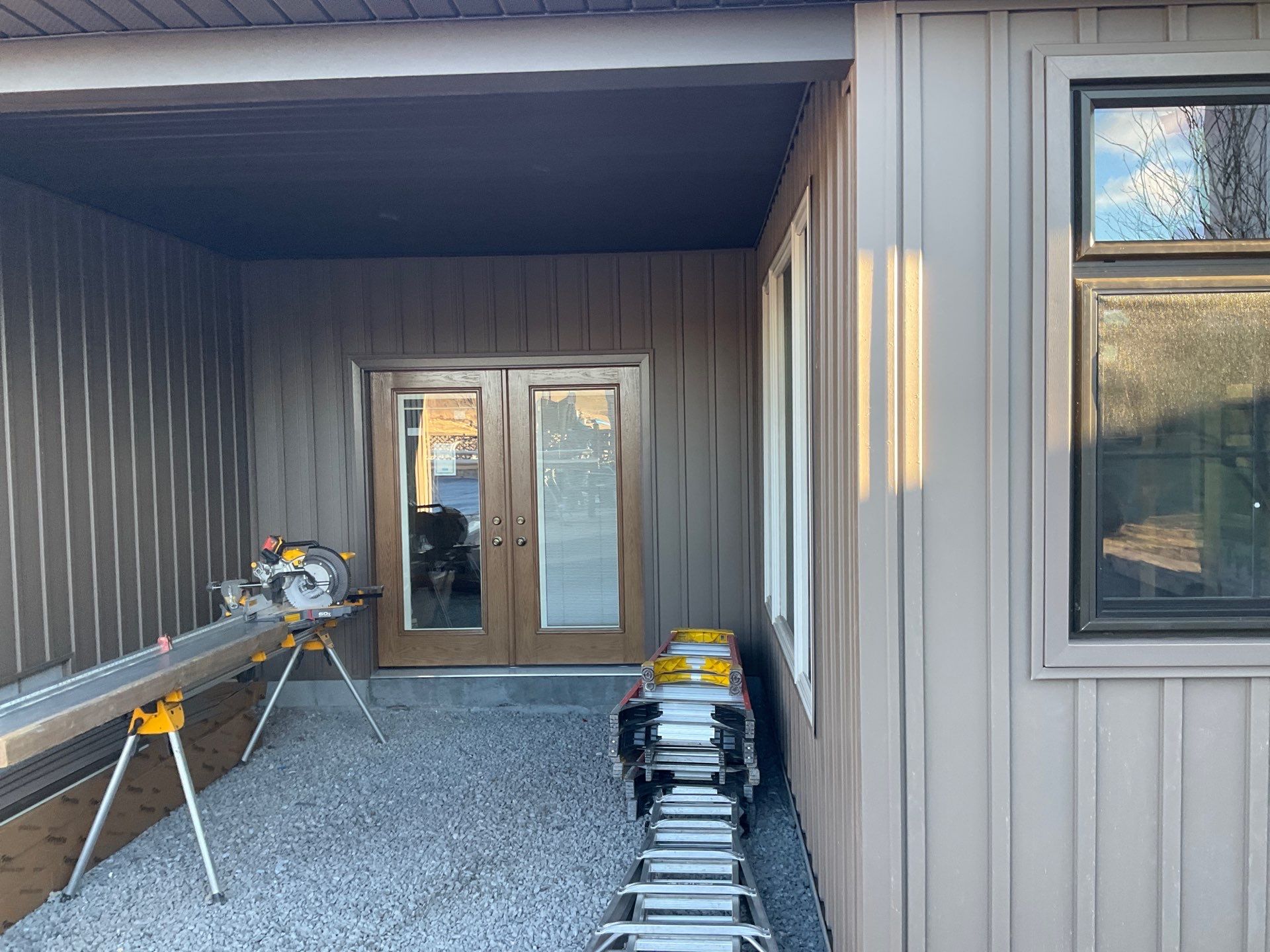 Multi-Story Residential Addition Featuring Textured Metal Siding in Millersburg by Esh Builders