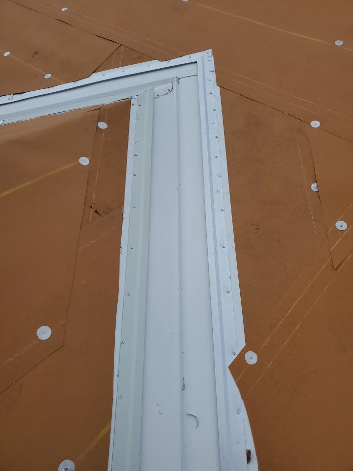 Residential Roofing Installation using 1.5" Nail Strip 24ga Solar White Kynar Coated Standing Seam Metal Panels by Morton Roofing, Inc.