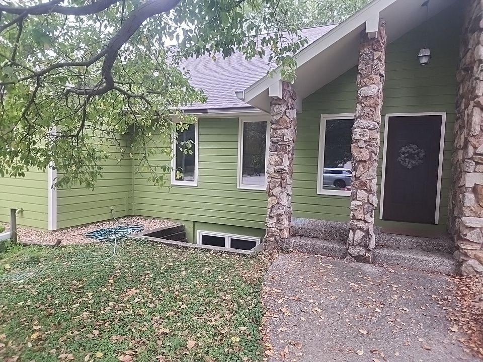 Complete house repaint to a different color  by Cutting edge painting 