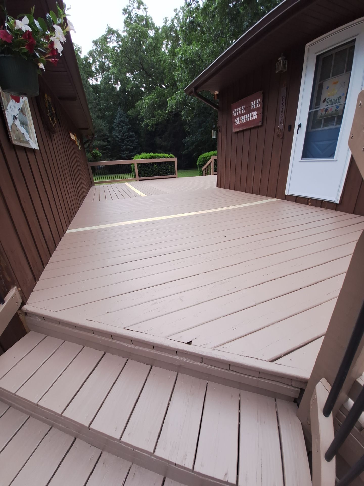 Muskegon Deck Restoration with Pressure Treated Railings and Wood Staining by Gordon Painting
