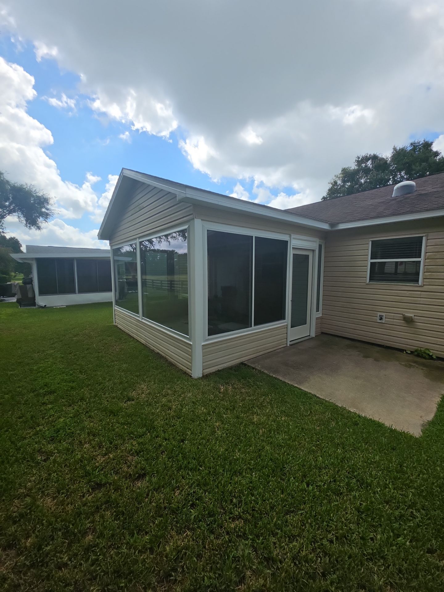 Sunroom Conversion with Alside Windows and Provia Door in The Villages by Windows & Doors Store