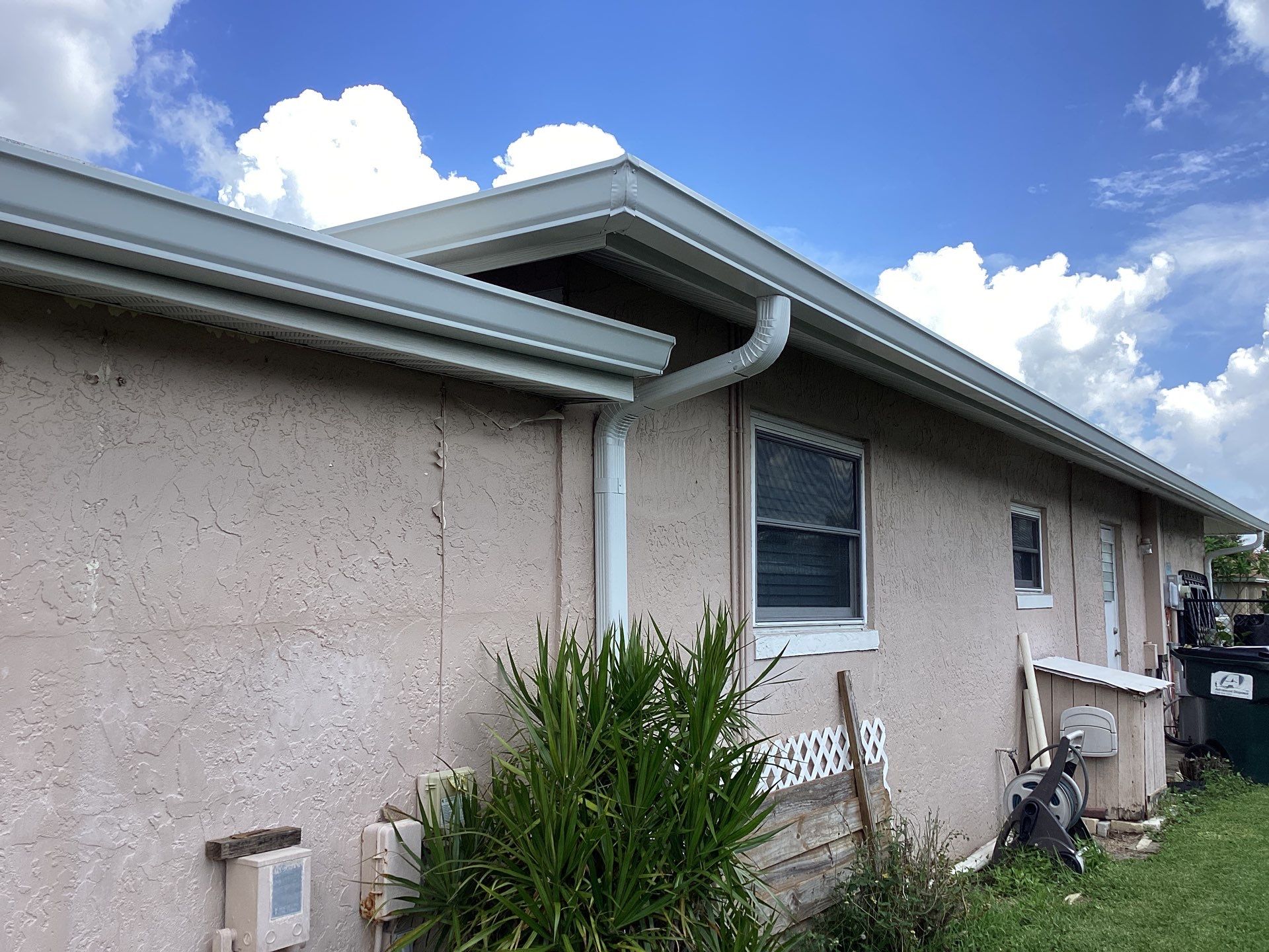 White Seamless Gutters and Splash Guards in Fort Myers FL by Gutter Professor by Gutter Professors
