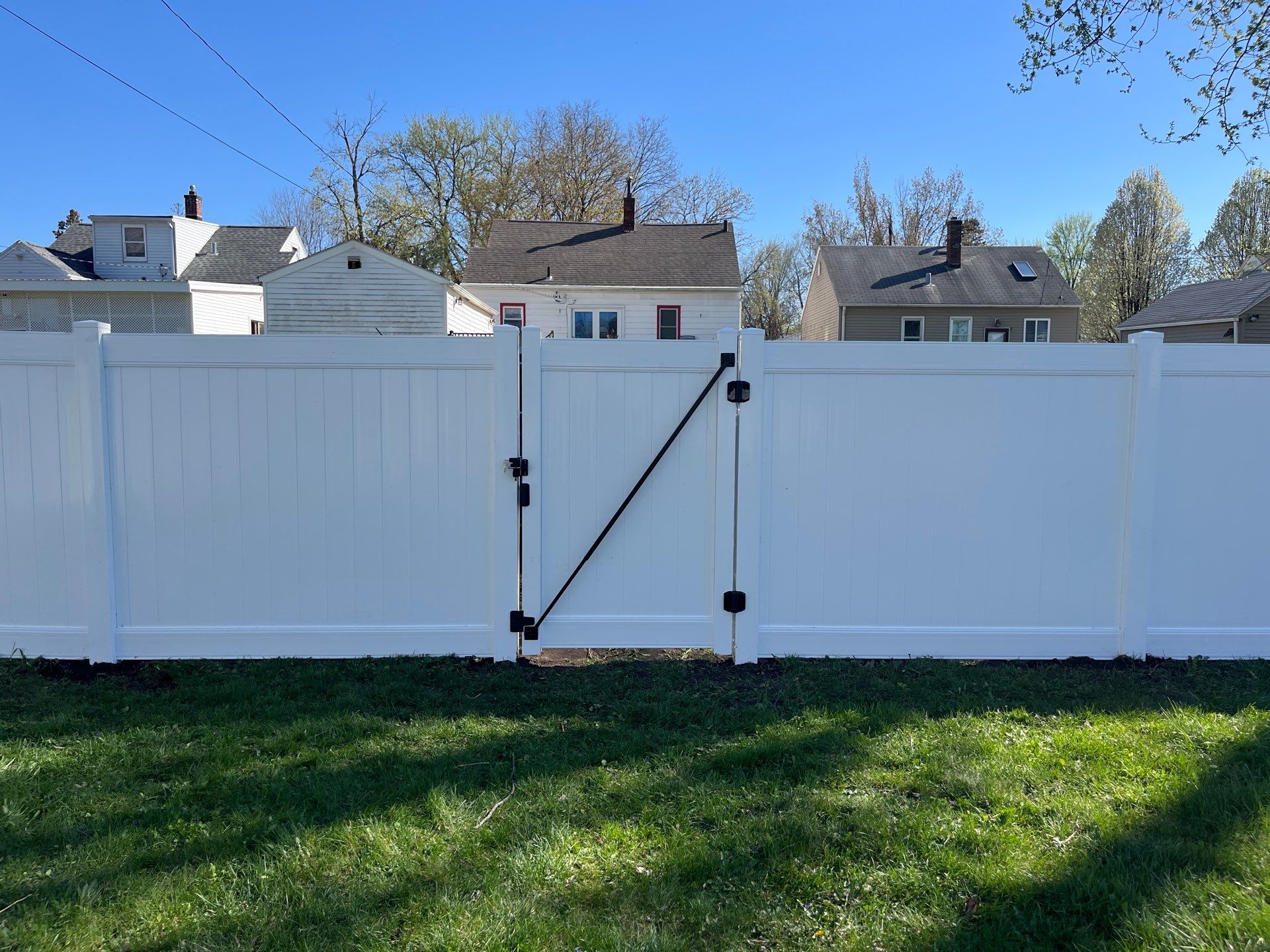Residential White Vinyl Privacy Fence Installation in Waterloo, Iowa by Perfect Picket Fence and Stain