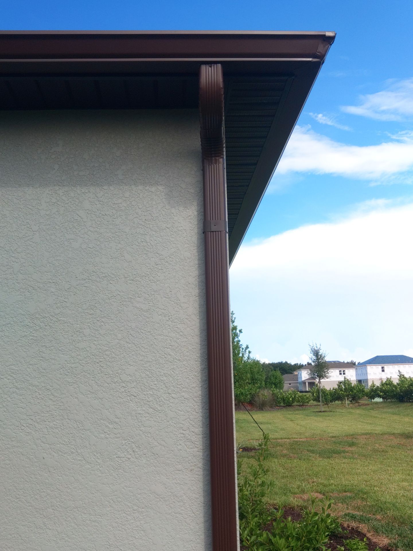 Musket Brown Seamless Gutters using Musket Brown Seamless Gutters in Nokomis FL by Gutter Professors