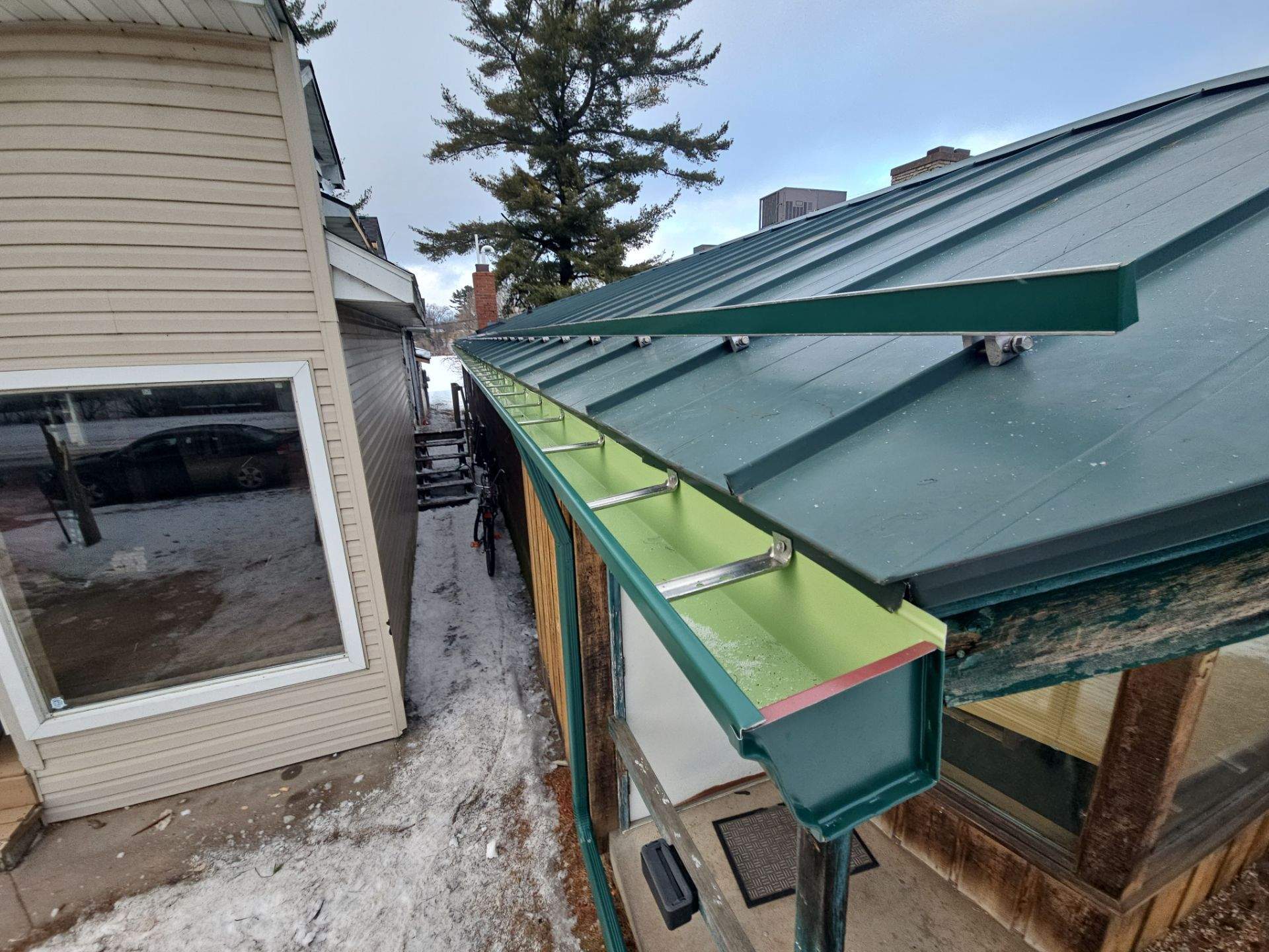Commercial Gutter System Installation using 6" K-Style Seamless Aluminum Gutters and Snow Stops by AA Seamless LLC