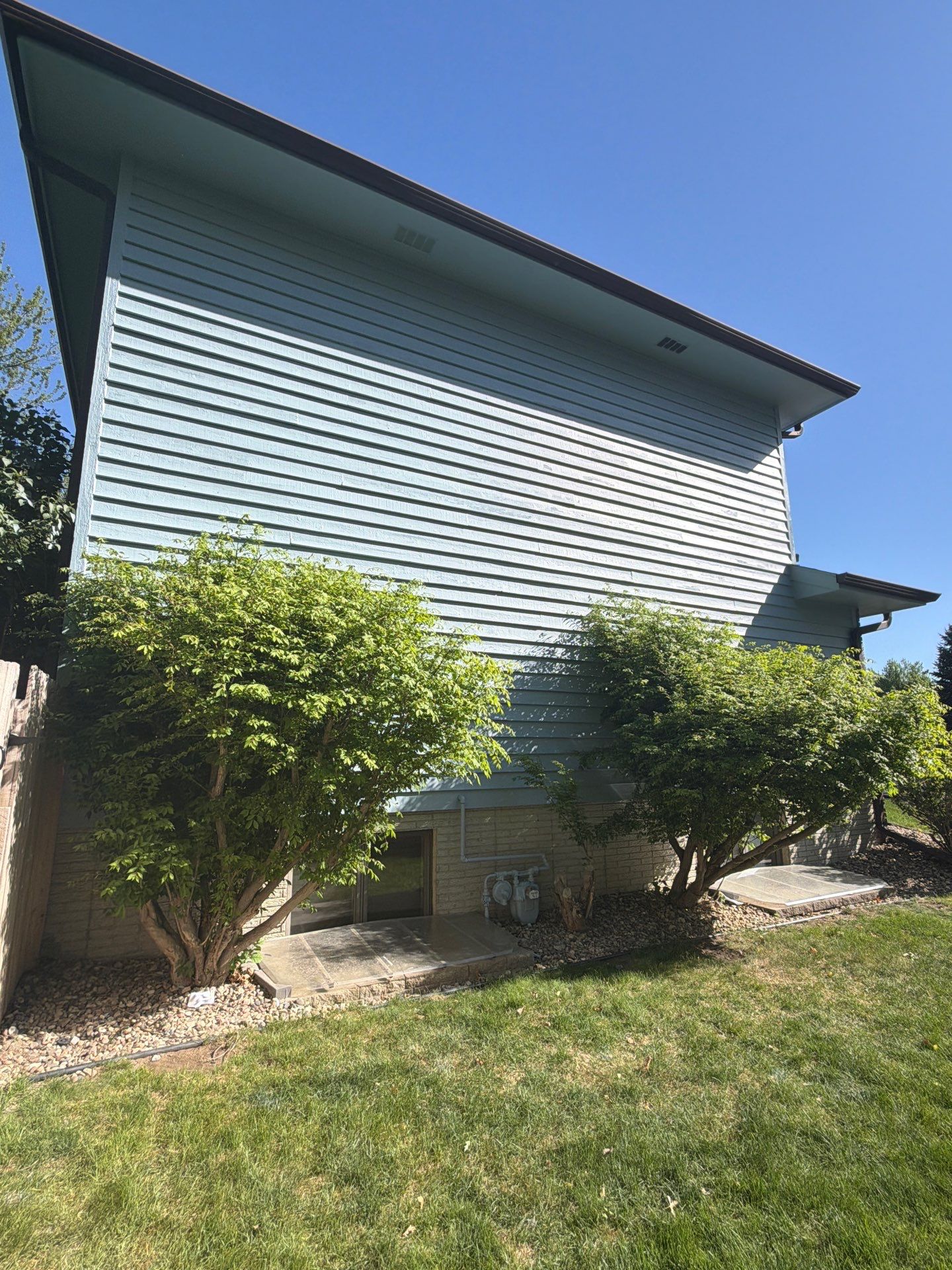 Full Exterior Home Painting and Siding Refurbishment in Sioux Falls by Select Painting, Coatings & Garage Cabinets