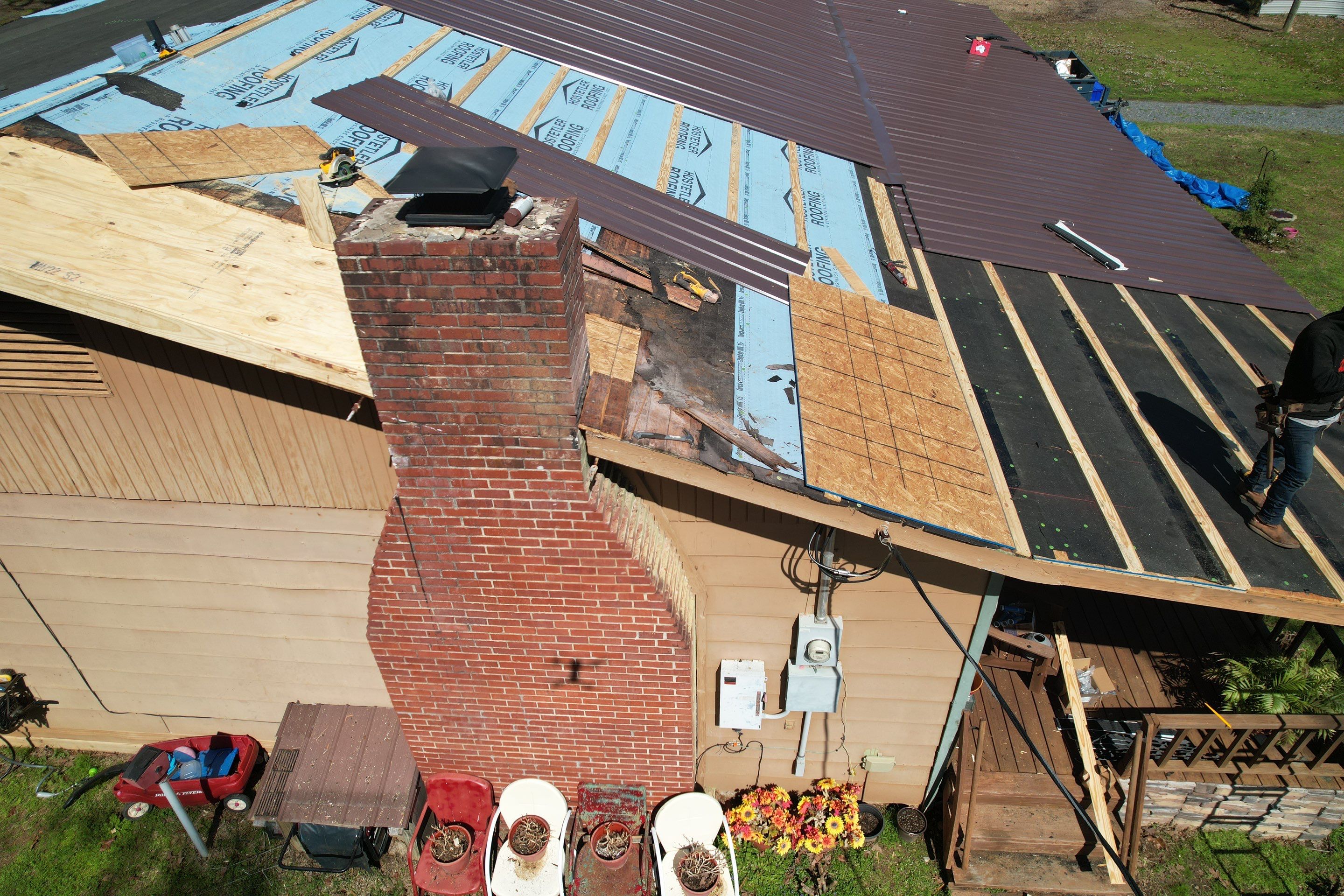 Residential Roofing Installation using 29 Gauge Colored Metal by Hostetler Roofing