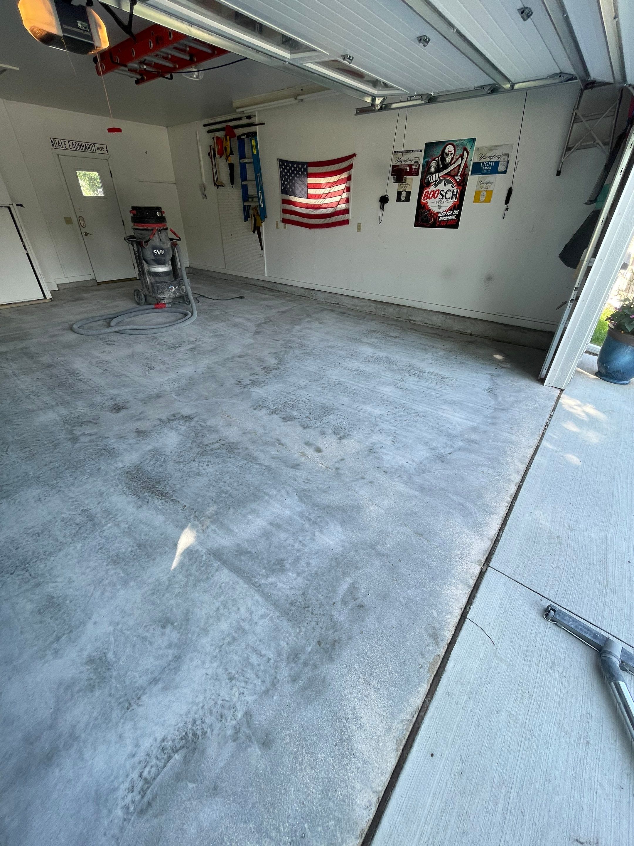 Residential Garage Floor Coating with Feather Grey Finish in Sioux Falls by Select Painting, Coatings & Garage Cabinets