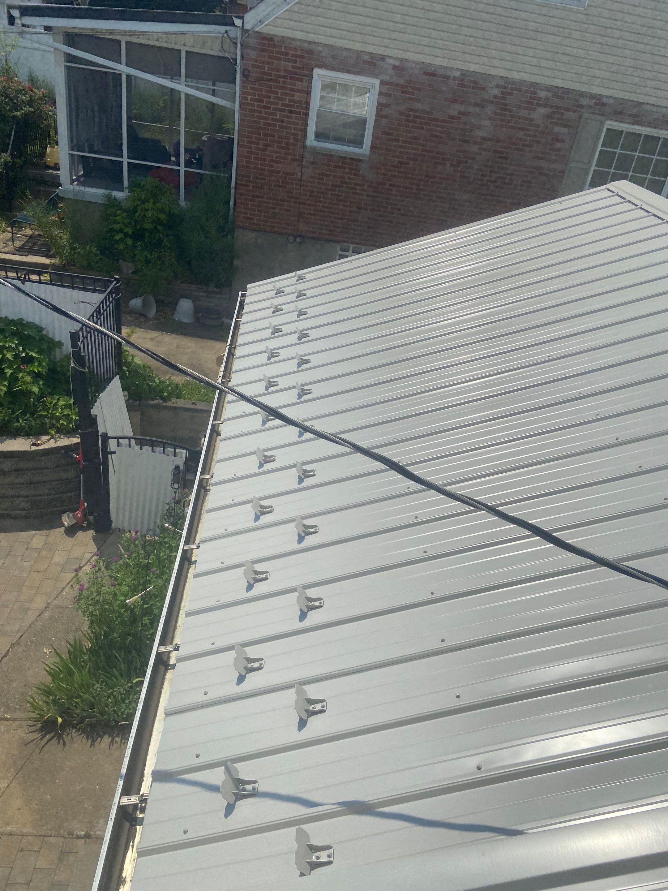 Metal Roofing, Skylights, Porch Build by Secure Construction Company Inc
