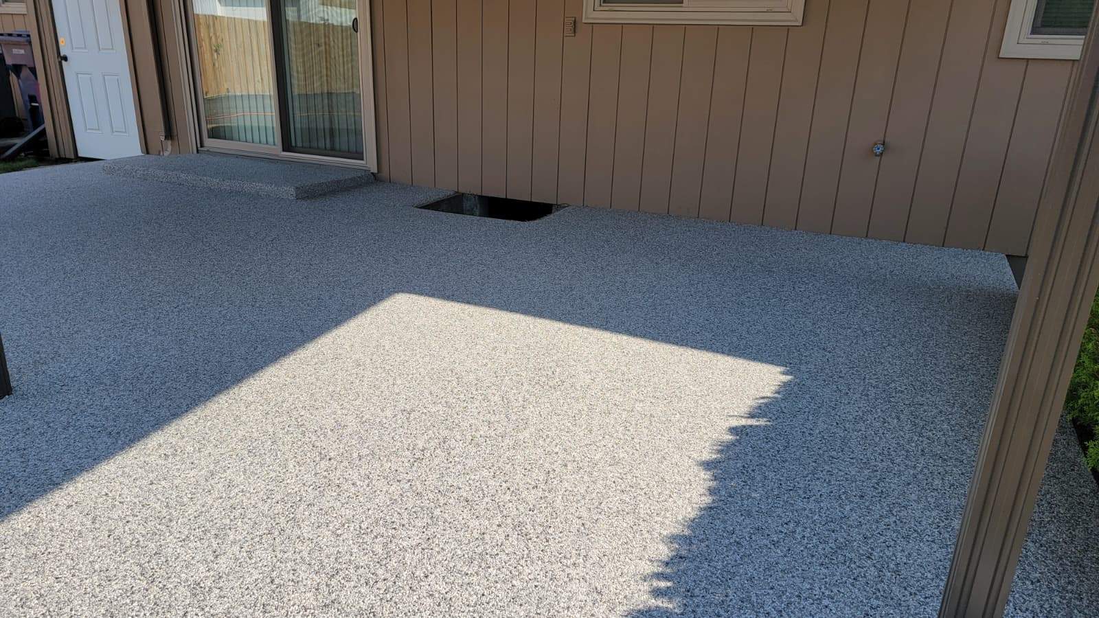 Coastal Elegance Patio in PoseidonVuba Stone by Concrete Coating Experts Inc.