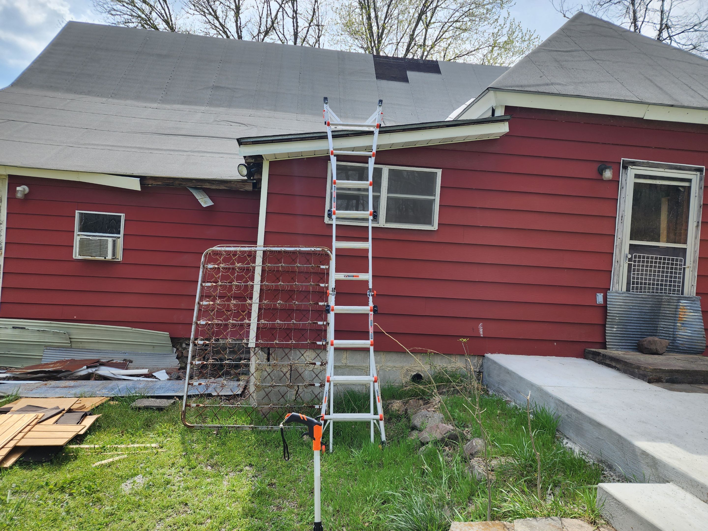 Residential Roofing Installation using 26 Gauge Colored Panels by Hostetler Roofing