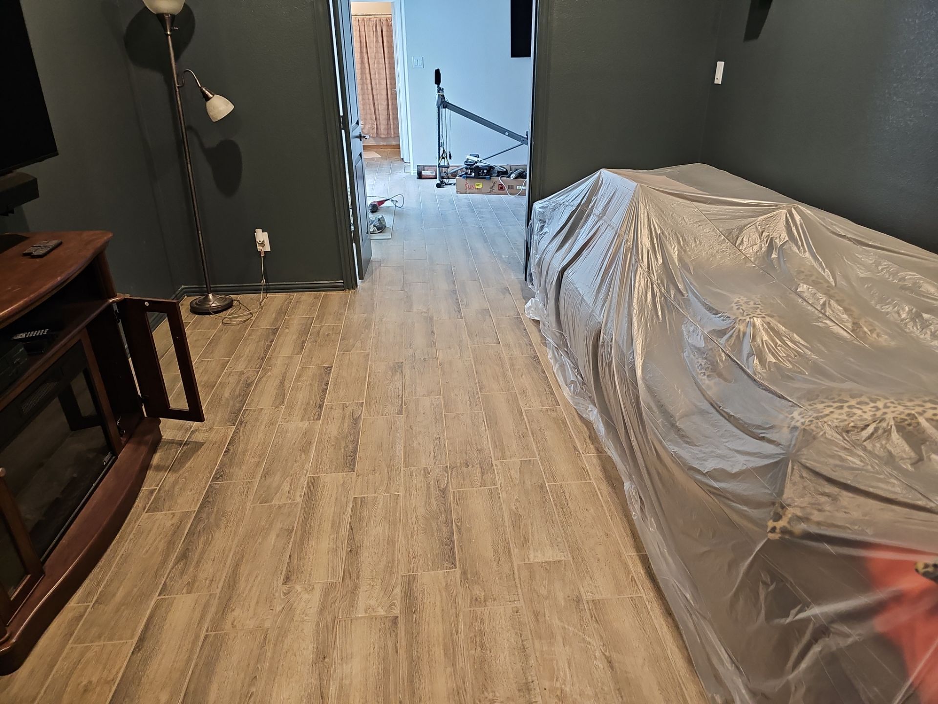 Carpet replacement with Tile and Red Oak Stairs by EL-GC LLC 