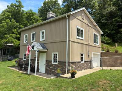 Jefferson Hills Vertical Board and Batten Siding and TandoStone Renovation