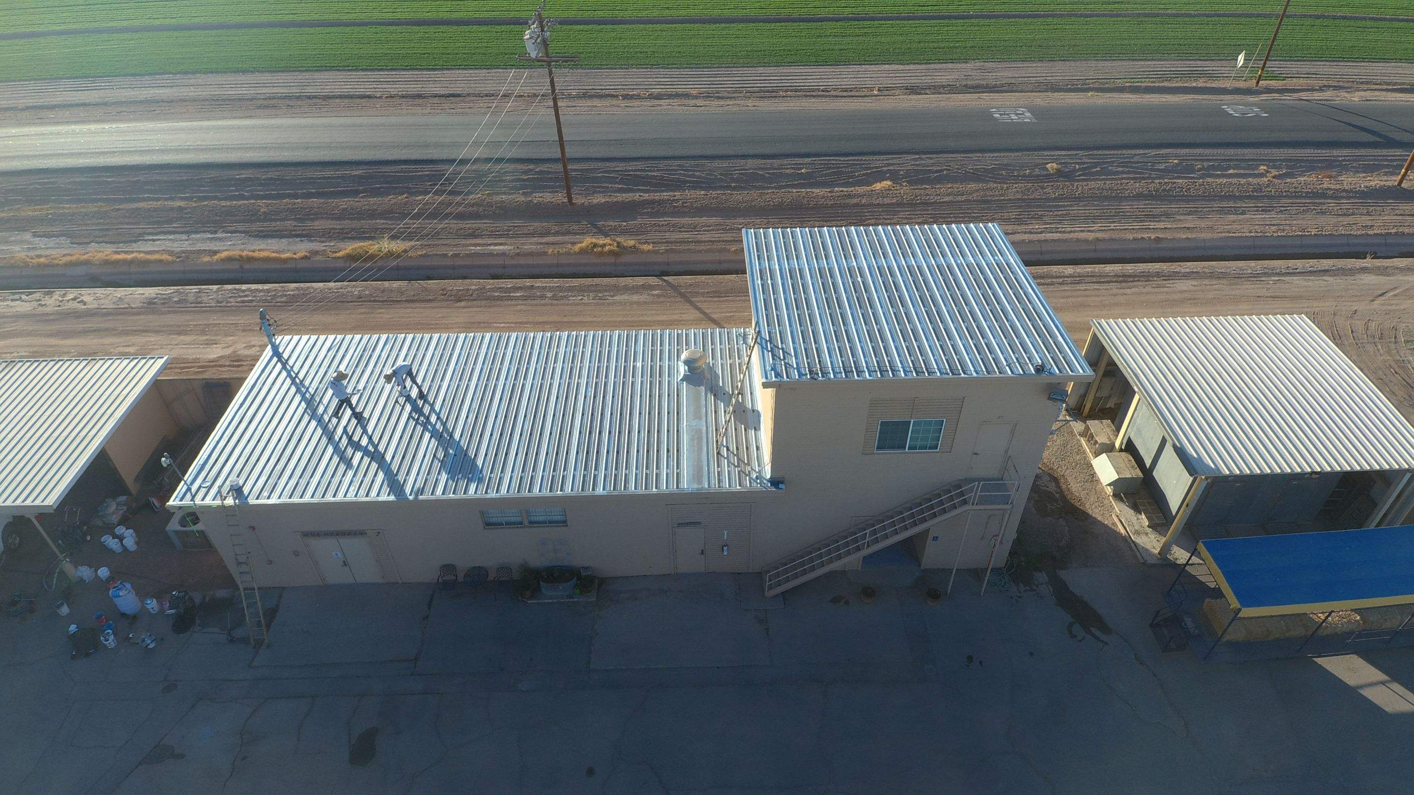 Metal roof restoration on commercial roof using Conklin Benchmark/PUMA XL fabric and coating by Straight Edge Roofing Inc