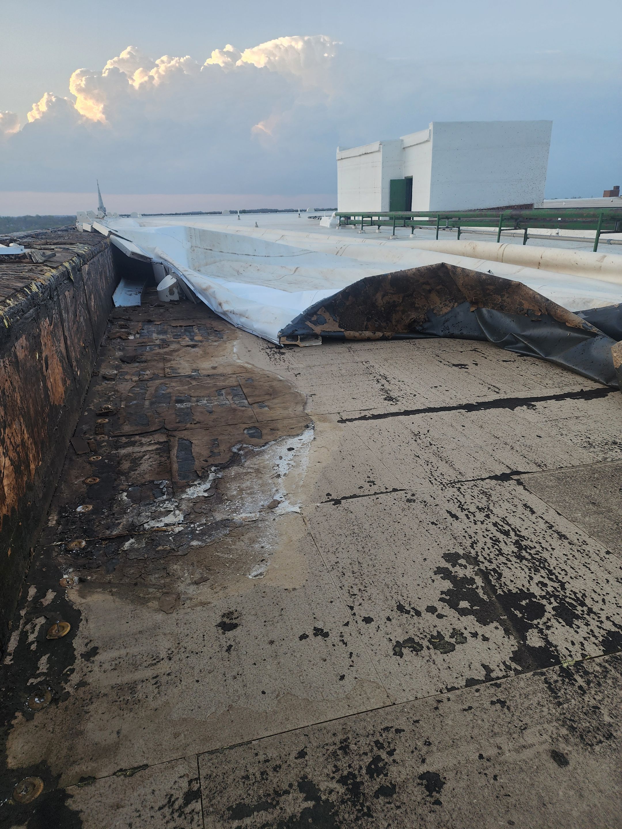Emergency Roof Repair - Turned Roof Replacement by Grell Roofing, LLC