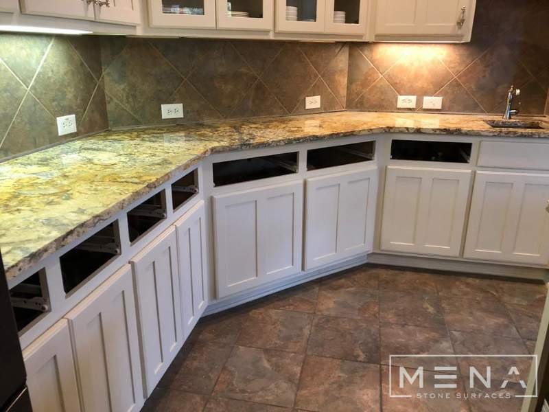 Kitchen countertops using Yellow River Granite  by Mena stone surfaces