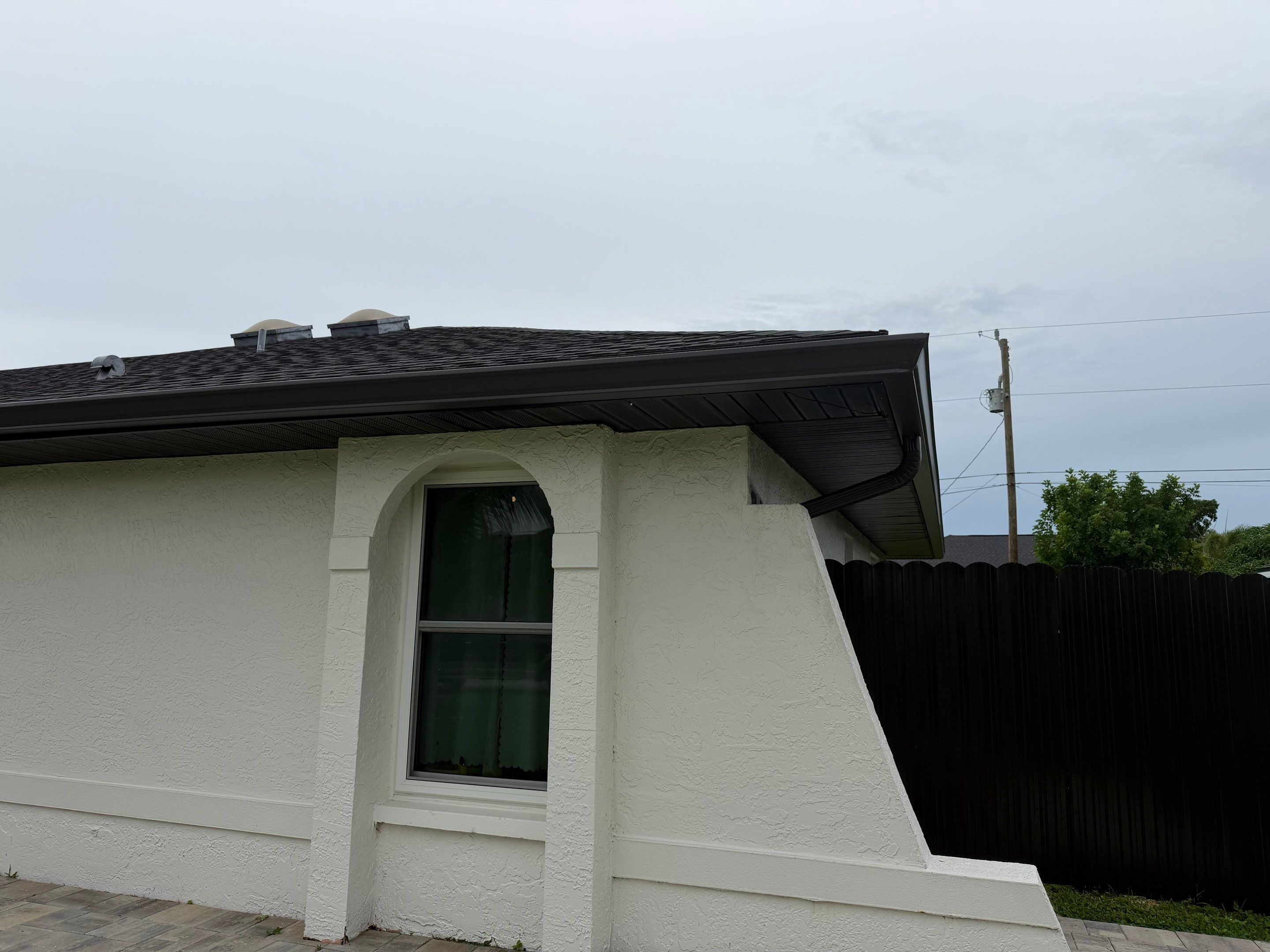 Black Seamless Gutters for a Modern Look in Cape Coral FL by Gutter Professors